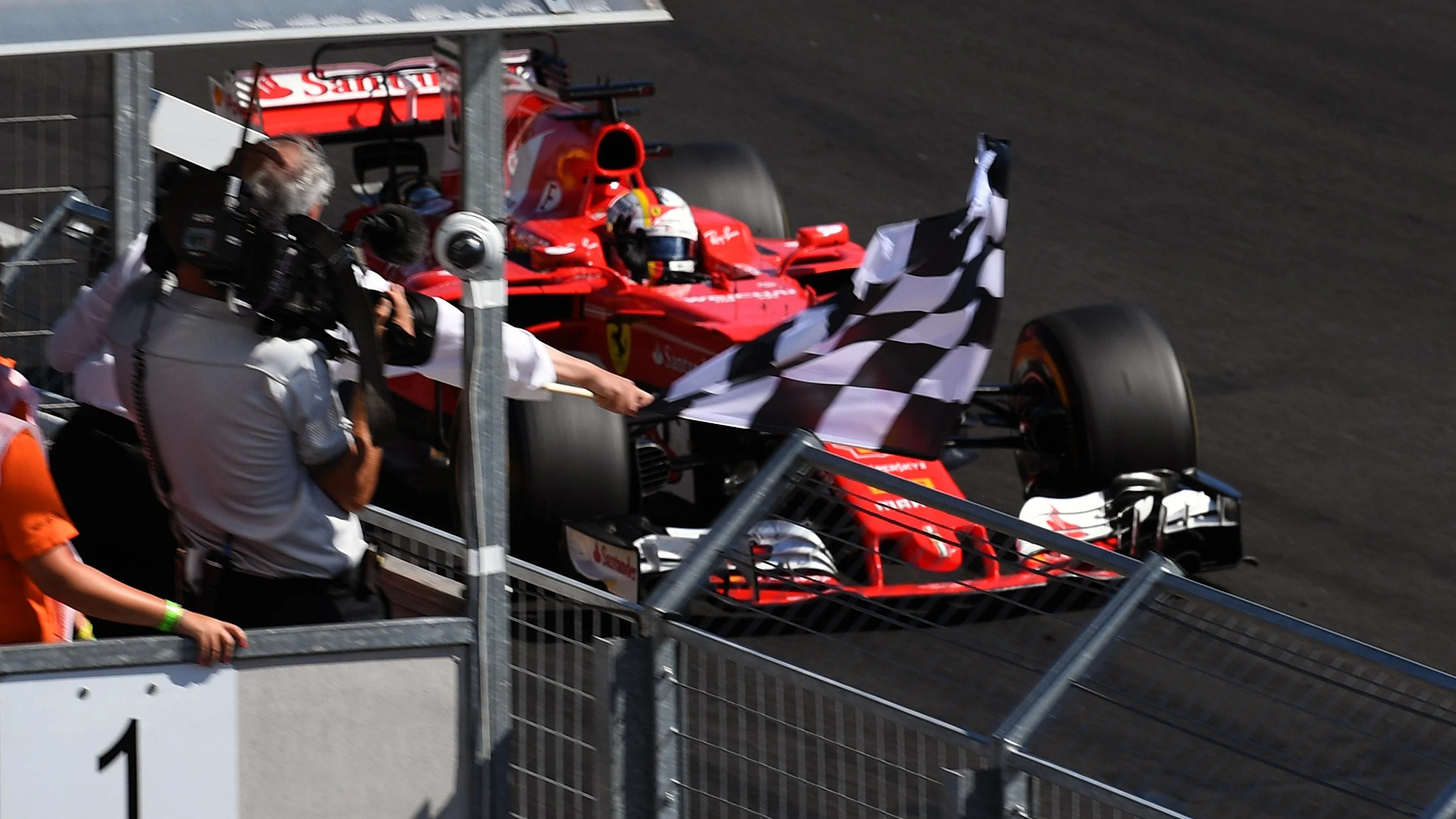 Race winner Sebastian Vettel (GER) Ferrari SF70-H takes the chequered flag at Formula One World