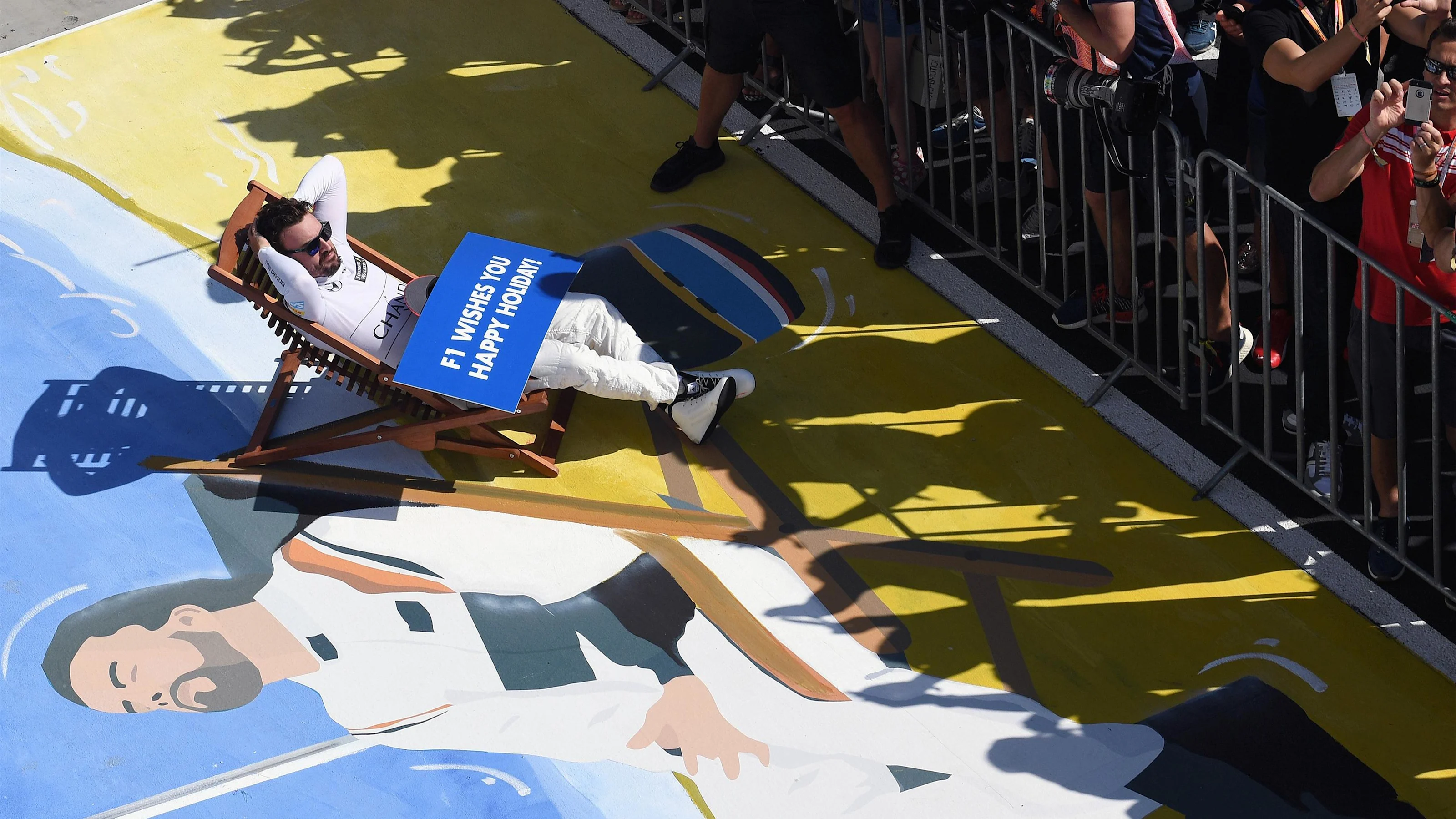 Fernando Alonso (ESP) McLaren on a deck chair in parc ferme at Formula One World Championship,