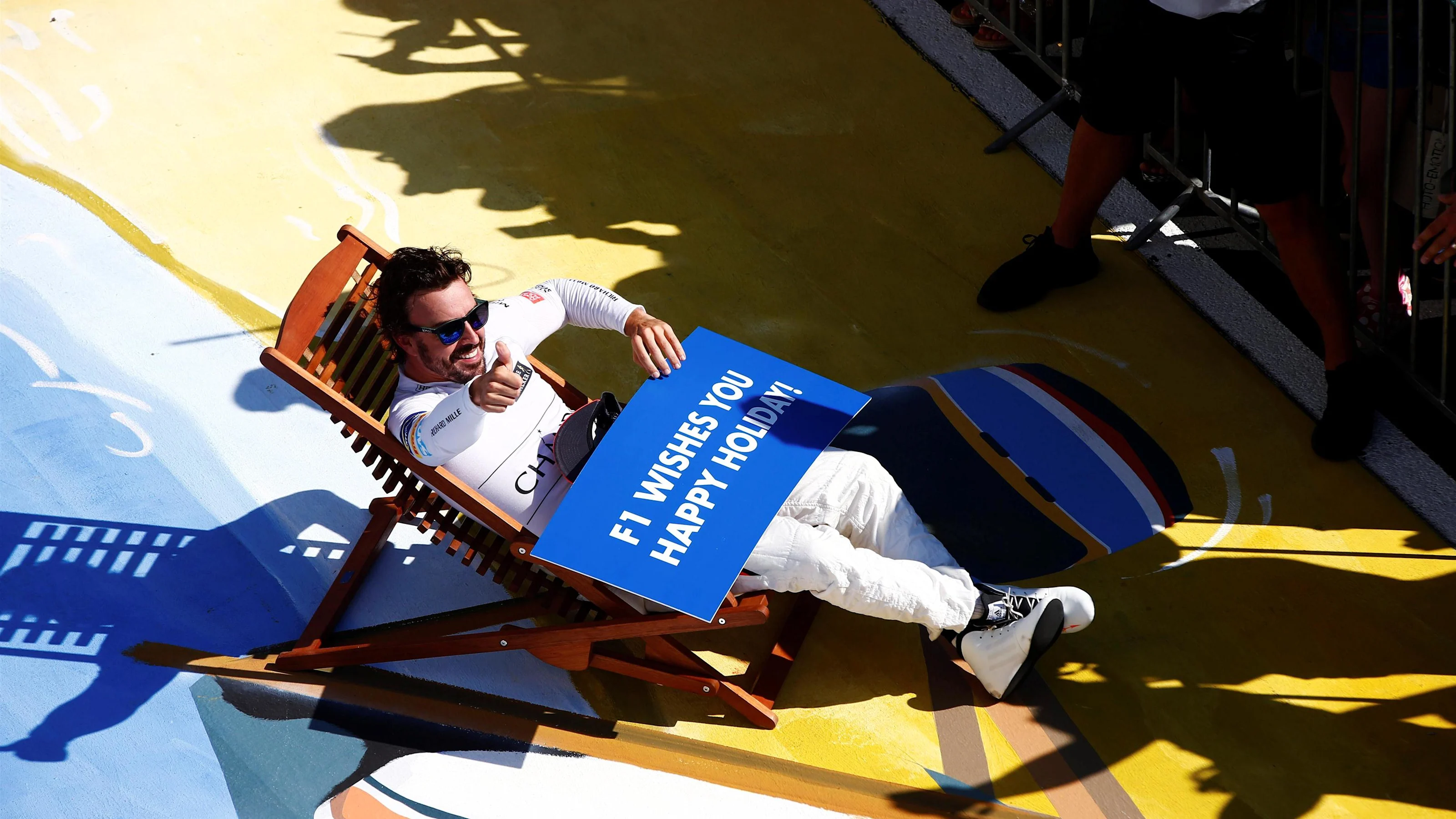Fernando Alonso (ESP) McLaren in a deck chair in parc ferme at Formula One World Championship,