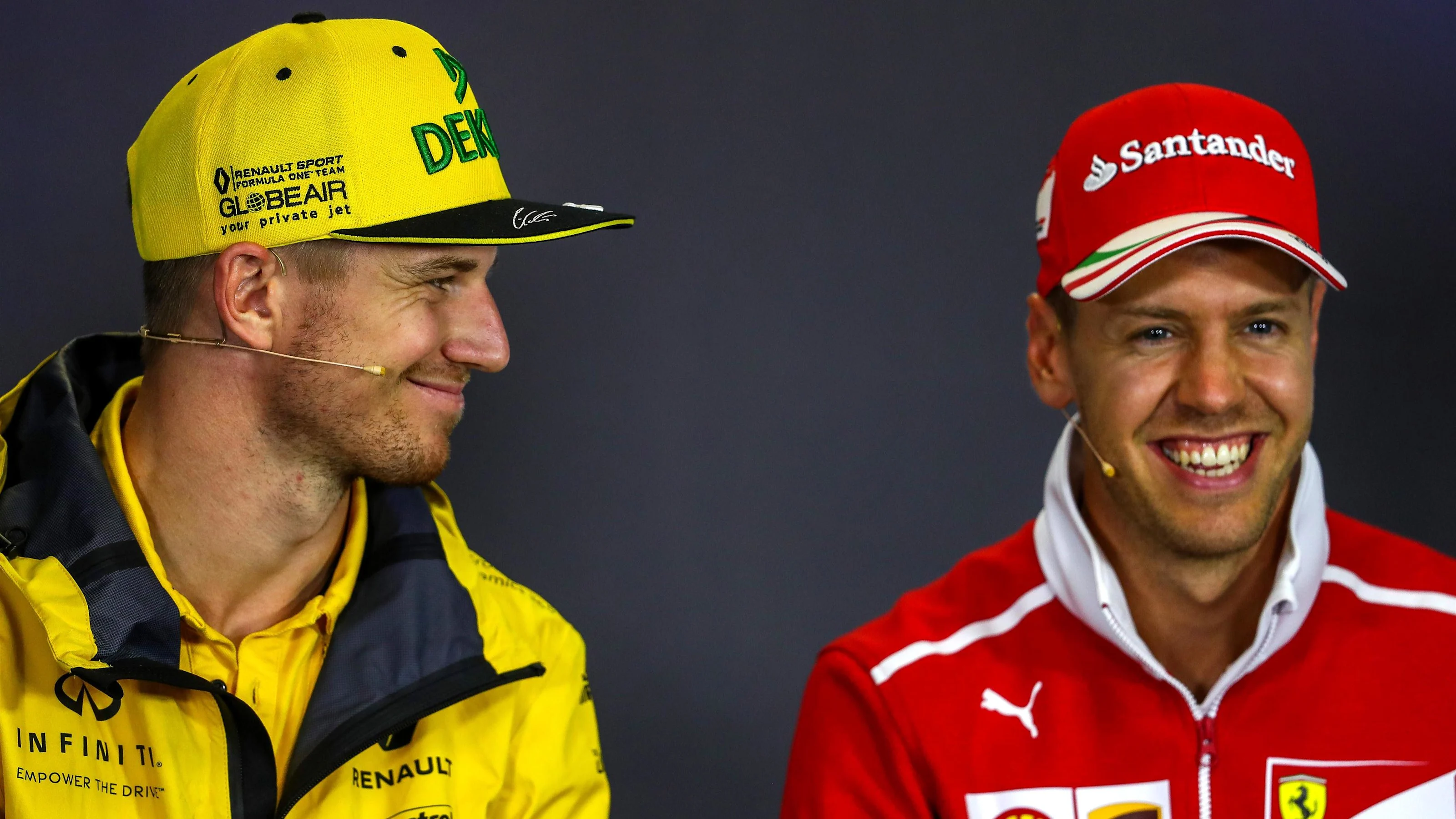 Nico Hulkenberg (GER) Renault Sport F1 Team and Sebastian Vettel (GER) Ferrari in the Press