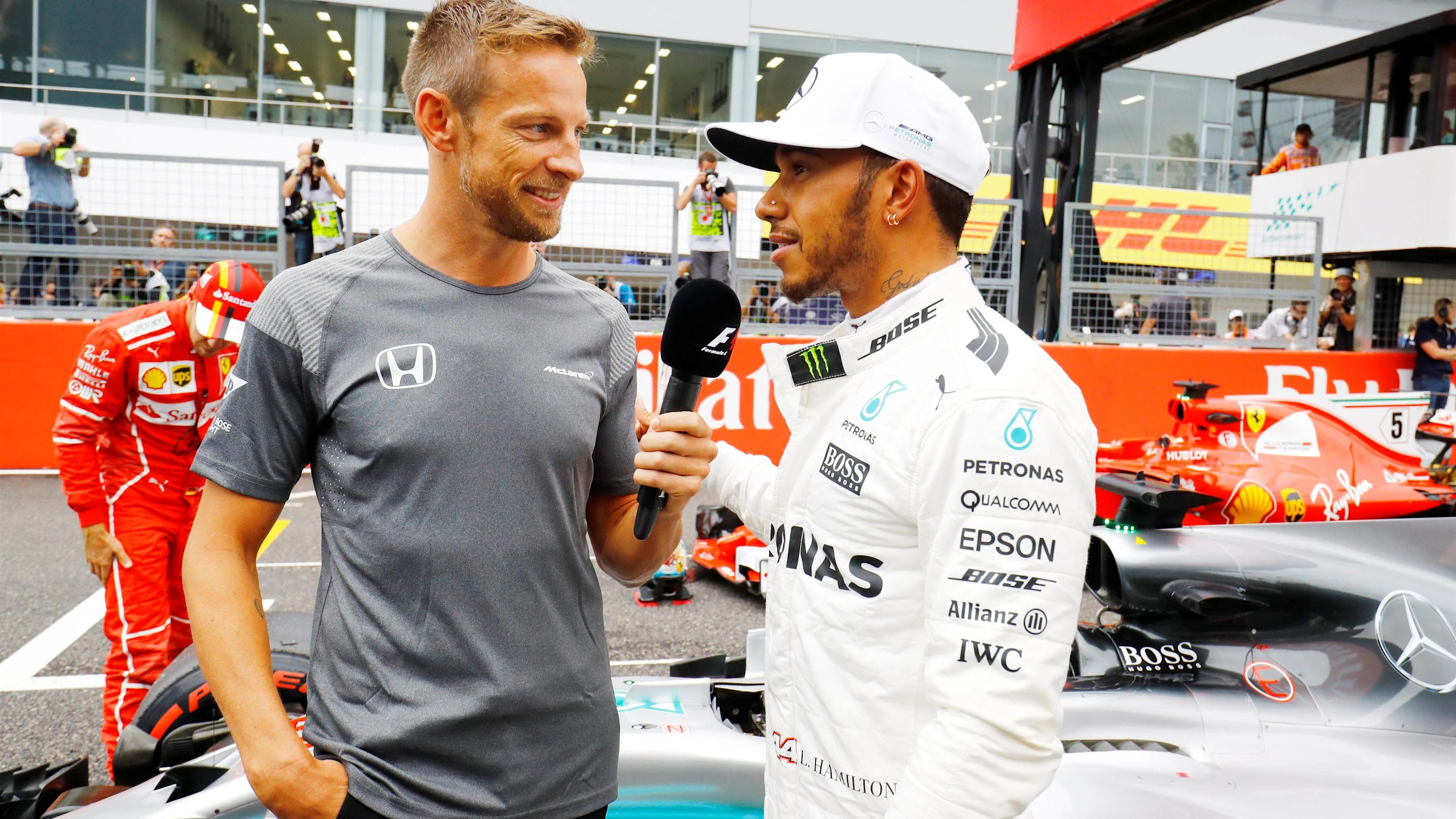 Pole sitter Lewis Hamilton (GBR) Mercedes AMG F1 talks with Jenson Button (GBR) in parc ferme at