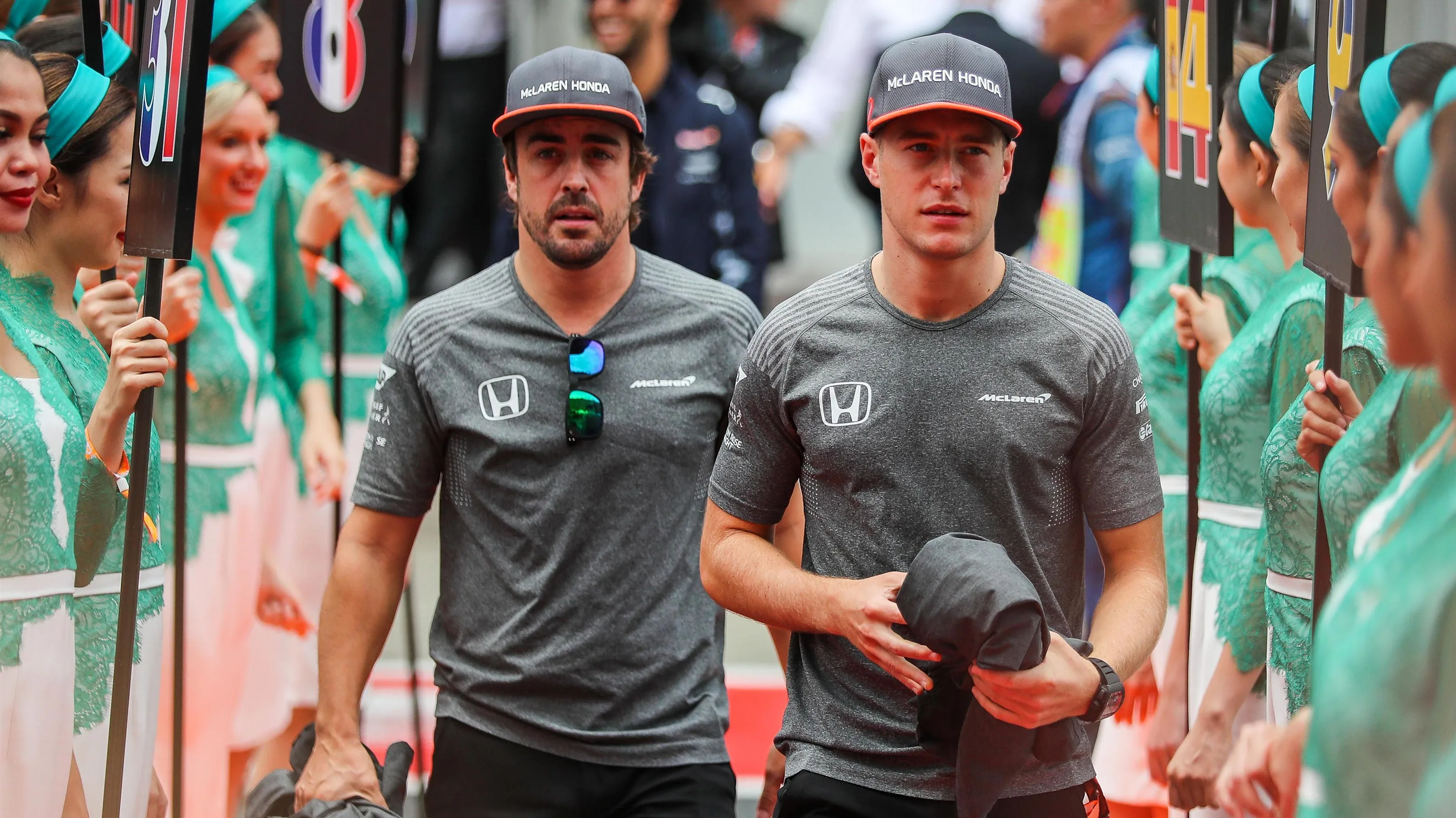 Stoffel Vandoorne (BEL) McLaren and Fernando Alonso (ESP) McLaren on the drivers parade at Formula