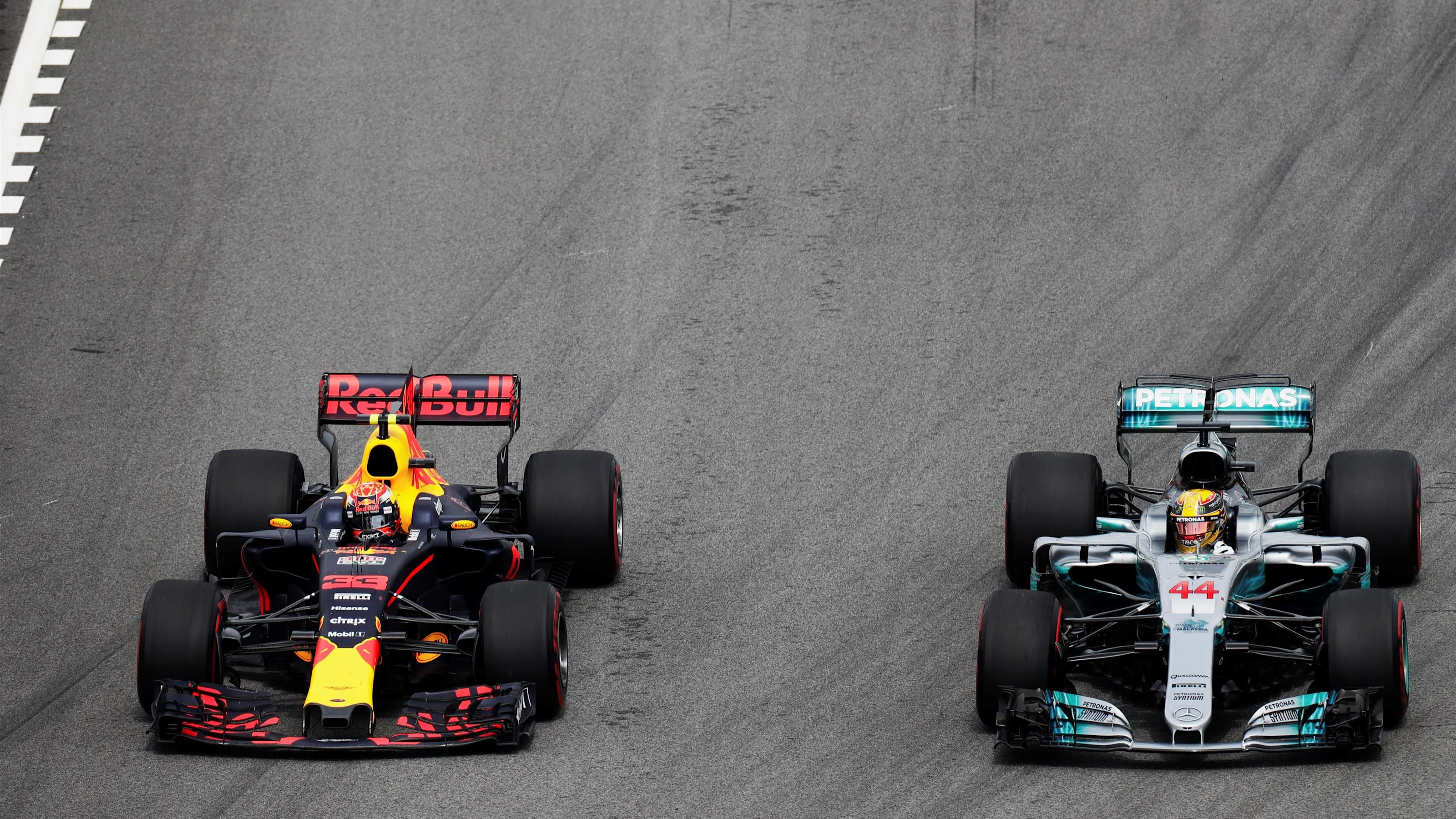 Max Verstappen (NED) Red Bull Racing RB13 overtakes Lewis Hamilton (GBR) Mercedes-Benz F1 W08
