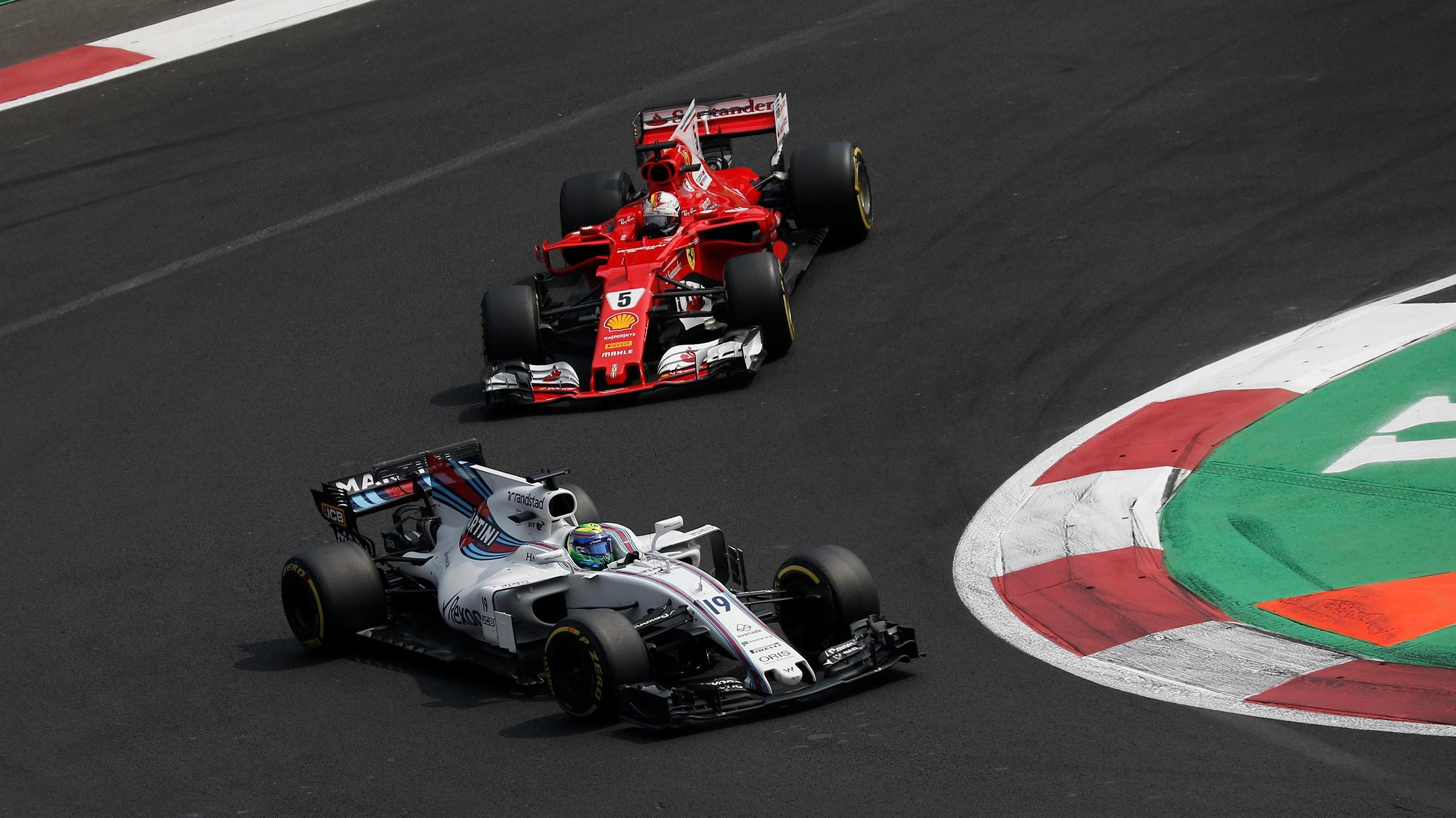 Felipe Massa (BRA) Williams FW40 and Sebastian Vettel (GER) Ferrari SF70-H battle at Formula One