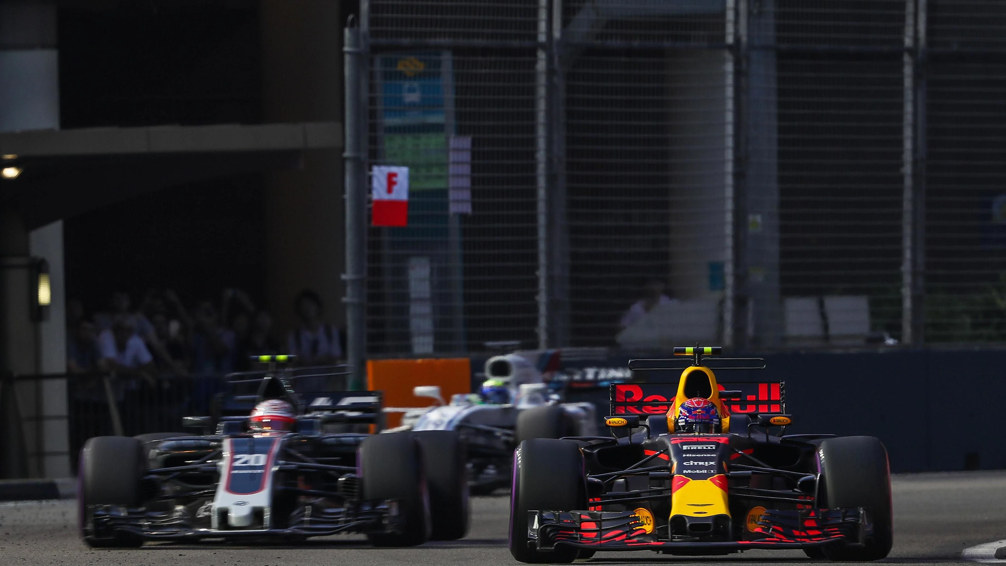 Max Verstappen (NED) Red Bull Racing RB13 and Kevin Magnussen (DEN) Haas VF-17 at Formula One World