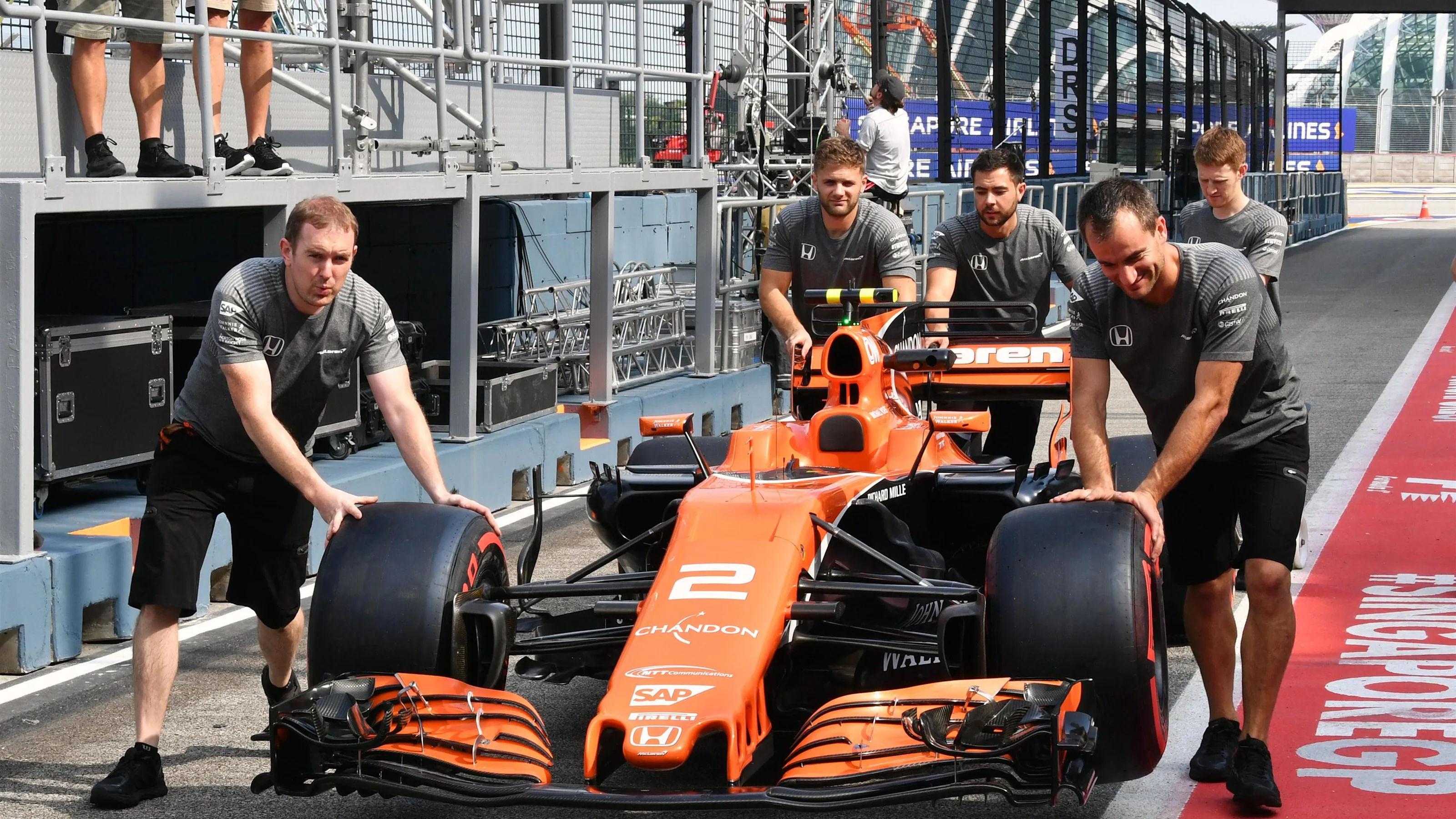 McLaren mechanics push McLaren MCL32 at Formula One World Championship, Rd14, Singapore Grand Prix,