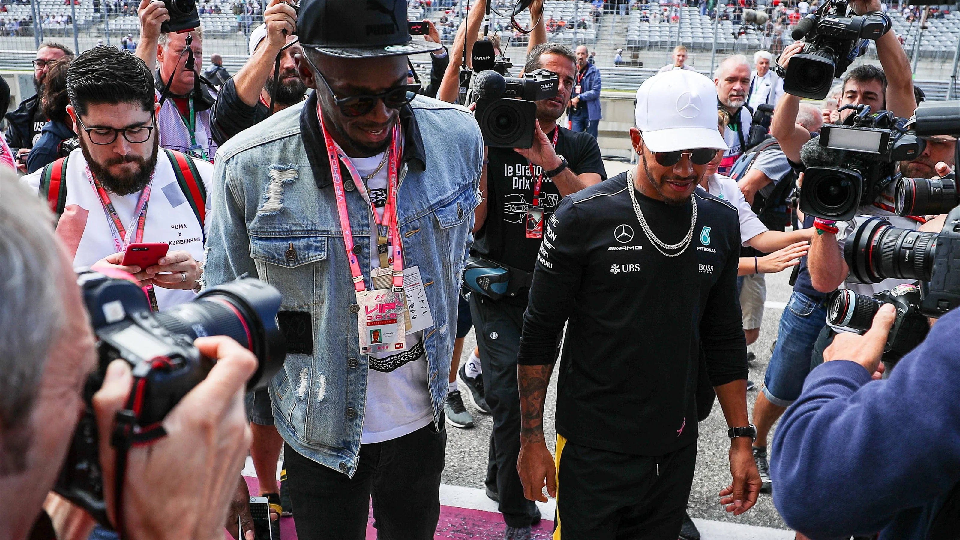 Usain Bolt (JAM) and Lewis Hamilton (GBR) Mercedes AMG F1 at Formula One World Championship, Rd17,