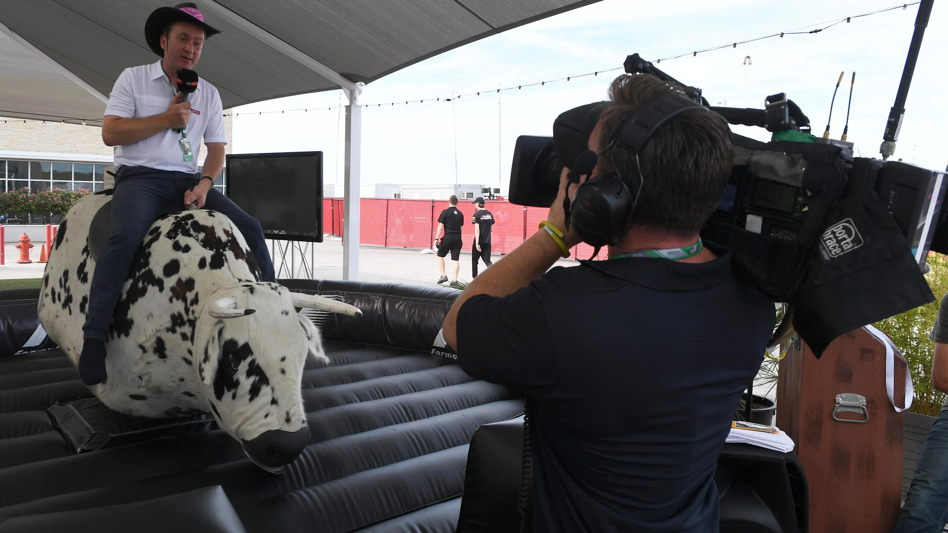 Craig Slater (GBR) Sky TV and bucking bronco at Formula One World Championship, Rd17, United States