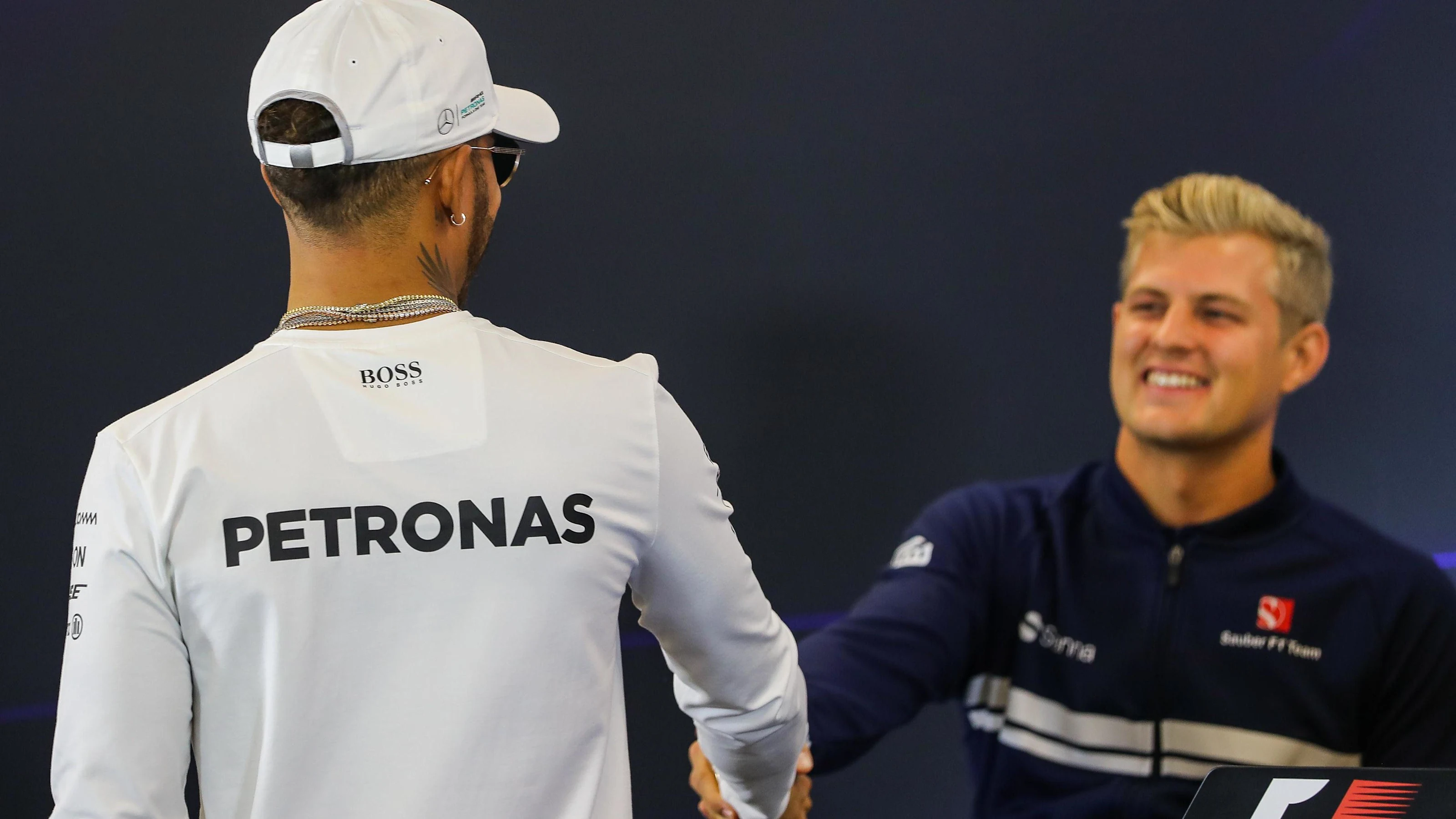 Lewis Hamilton (GBR) Mercedes AMG F1 and Marcus Ericsson (SWE) Sauber at Formula One World