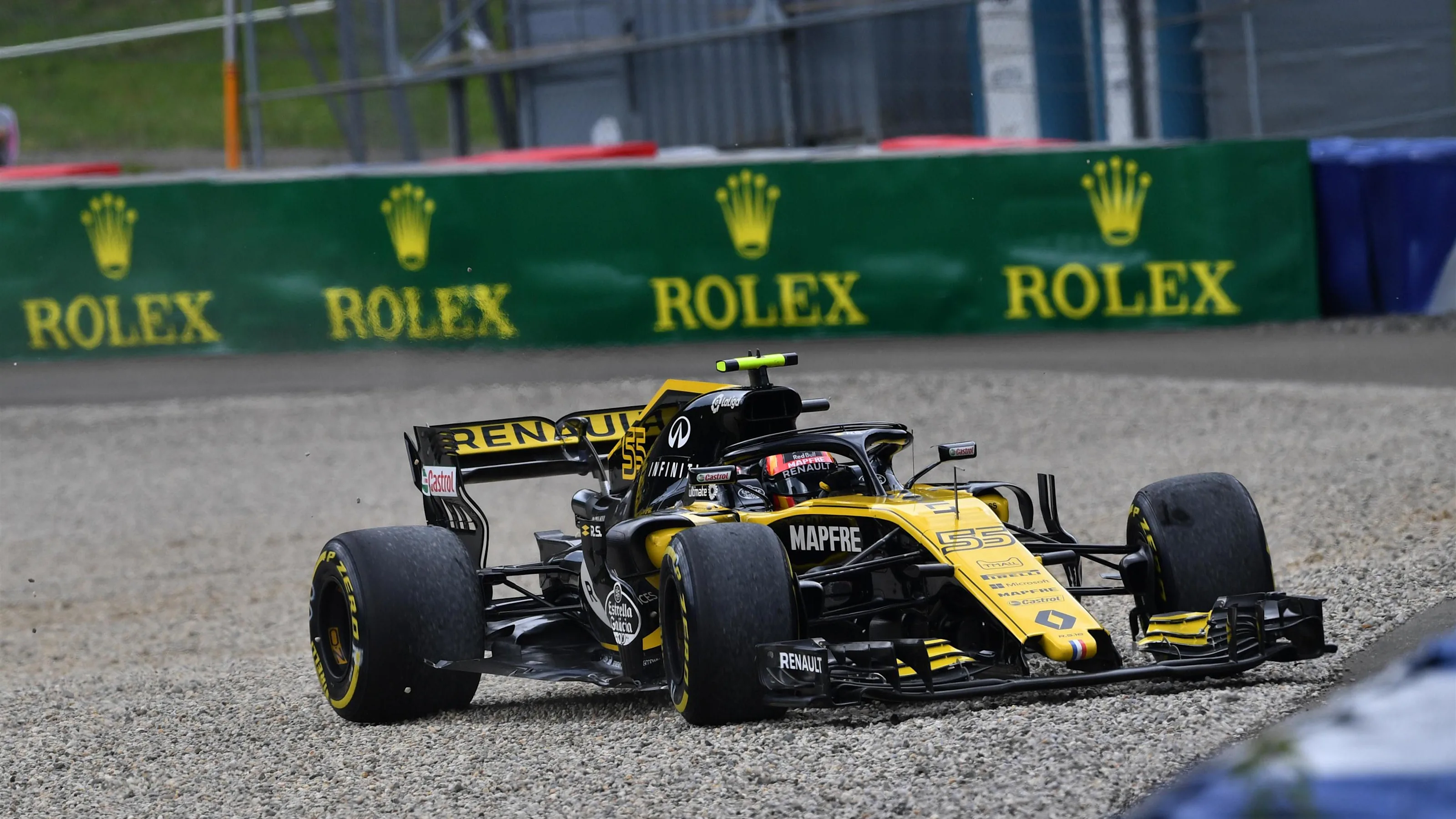 Carlos Sainz jr (ESP) Renault Sport F1 Team RS18 runs through the gravel at Formula One World