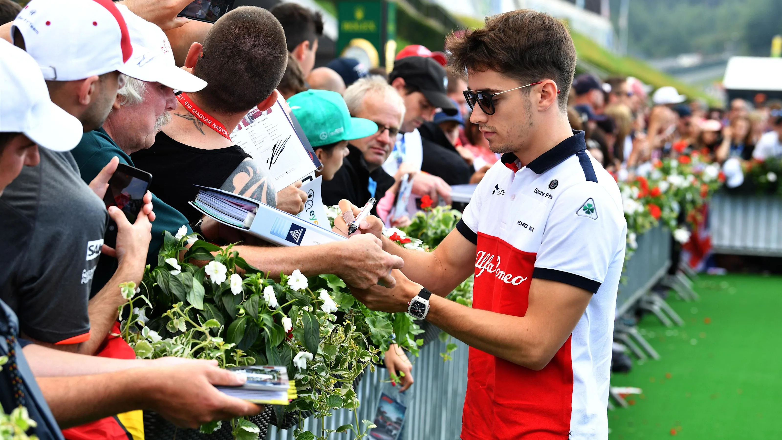 Charles Leclerc (MON) Alfa Romeo Sauber F1 Team signs autographs for the fans at Formula One World