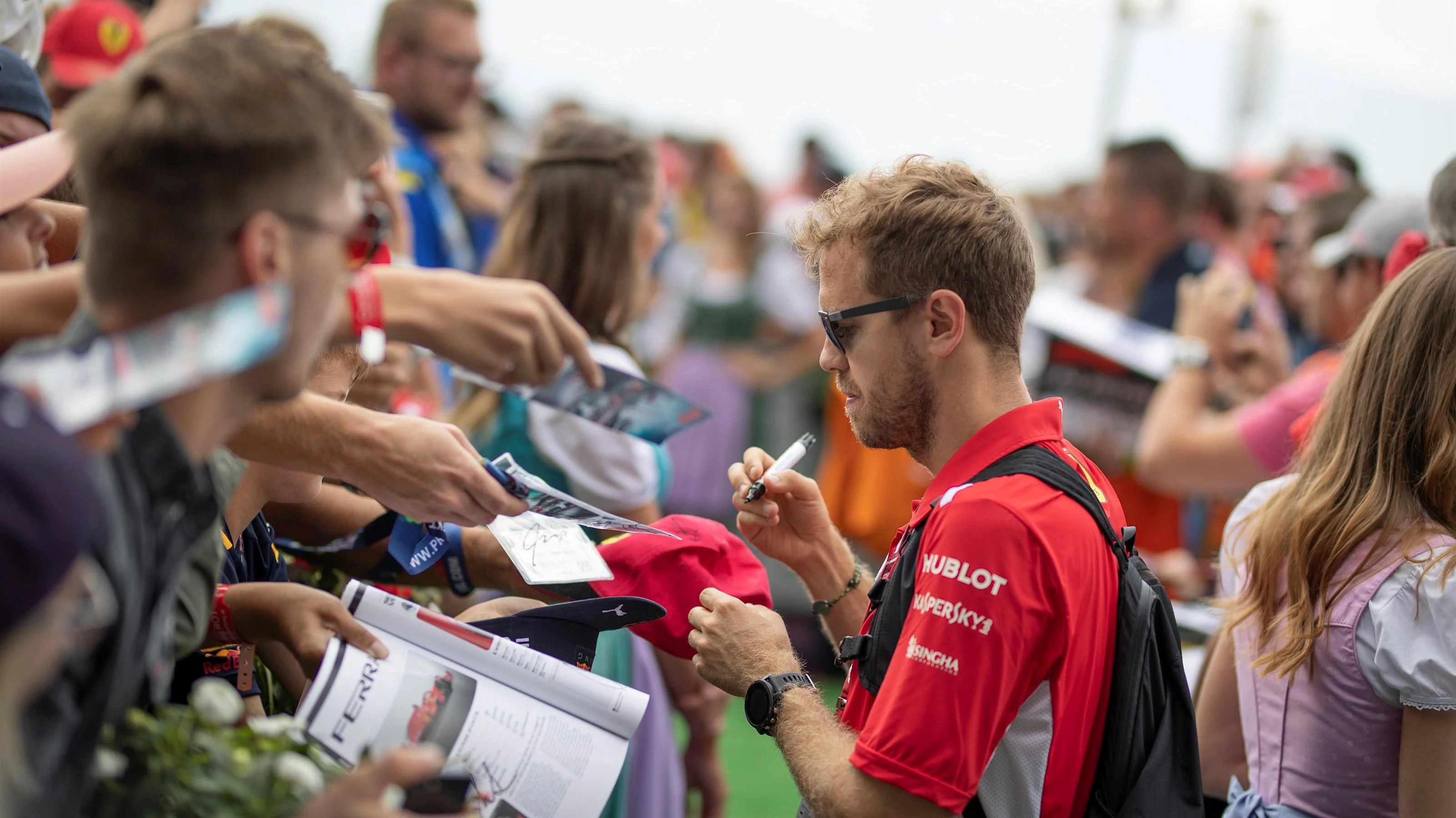 Sebastian Vettel (GER) Ferrari signs autographs for the fans at Formula One World Championship,