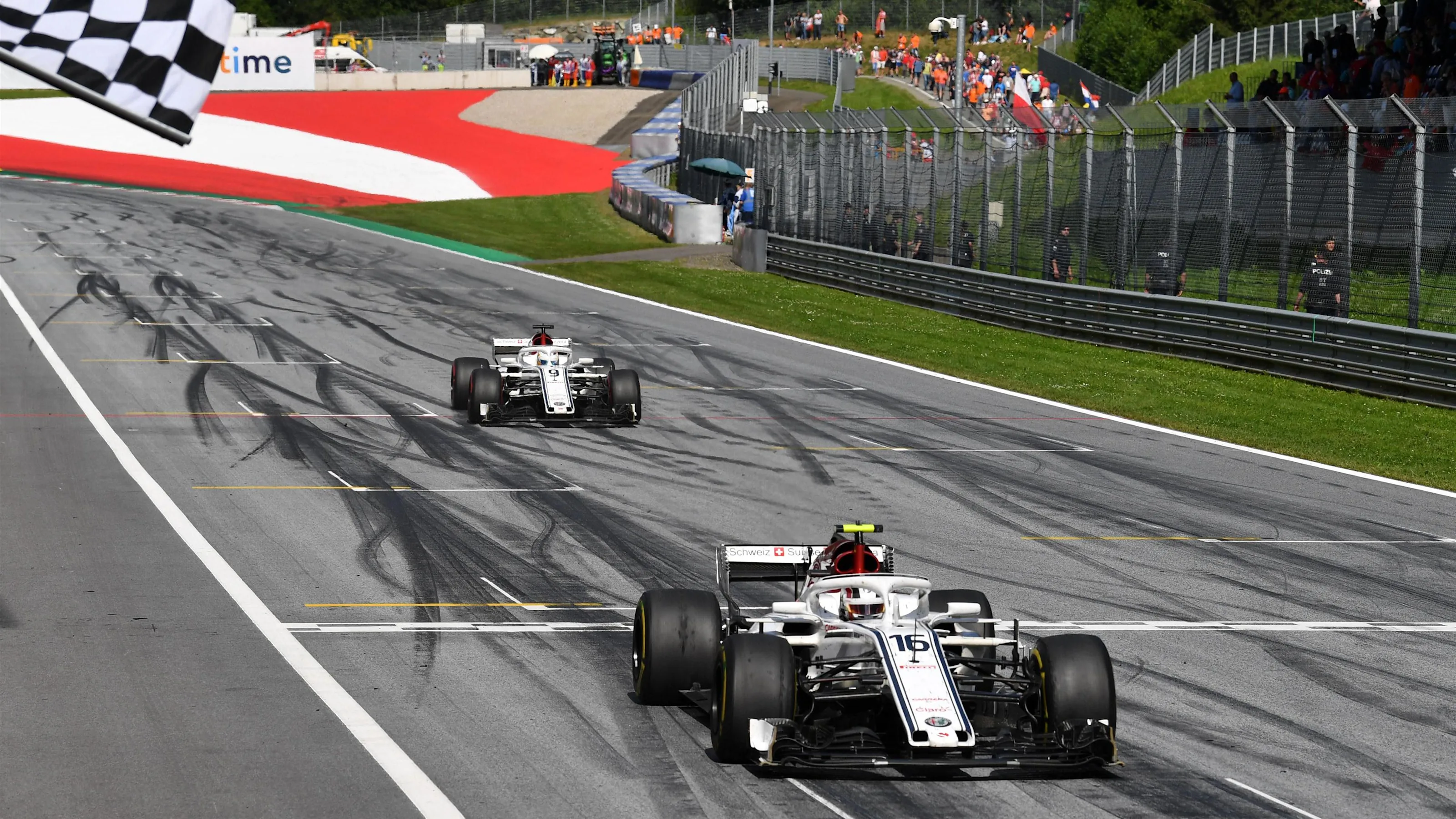 Charles Leclerc (MON) Alfa Romeo Sauber C37 and Marcus Ericsson (SWE) Alfa Romeo Sauber C37 take
