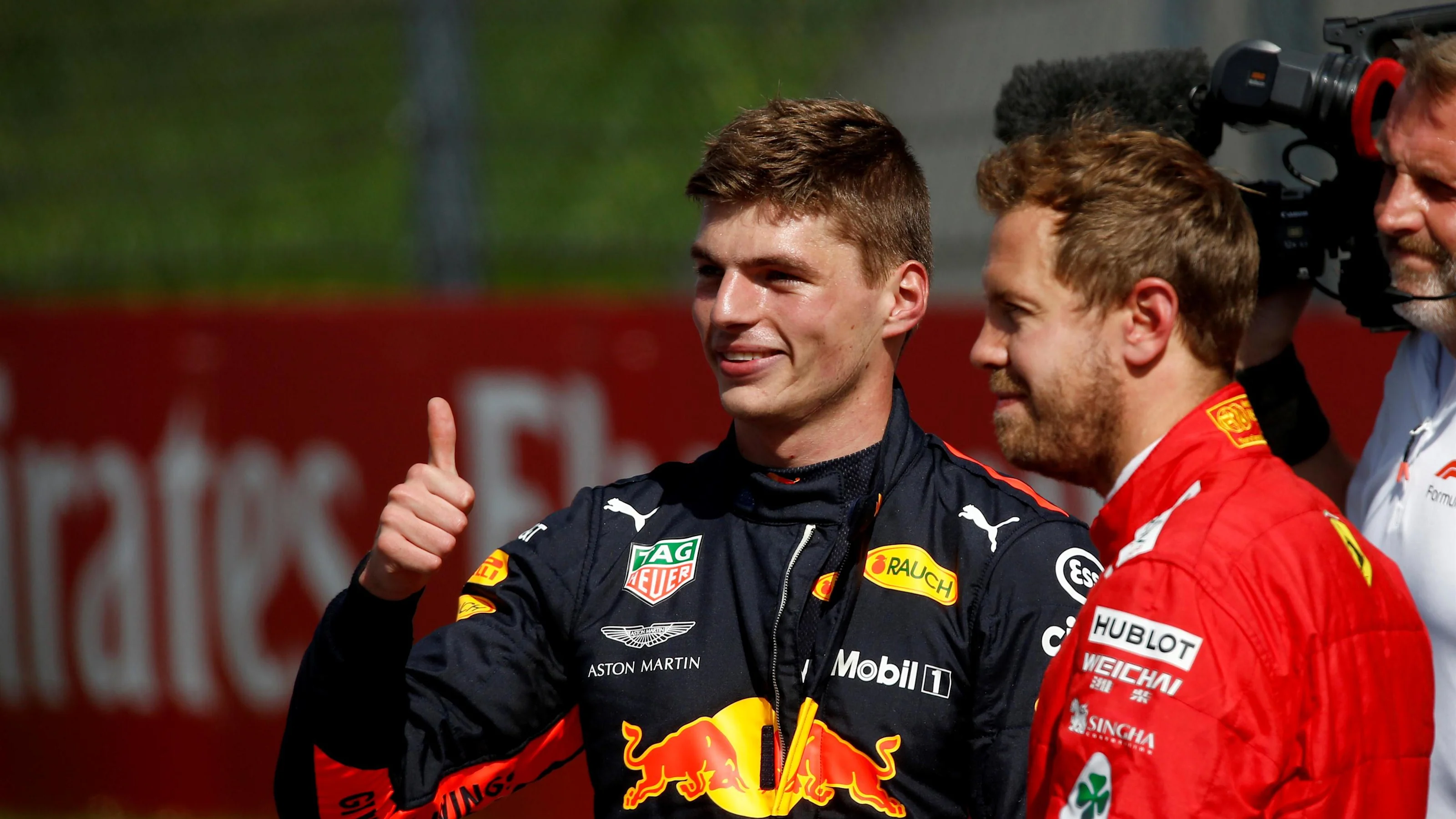 Race winner Max Verstappen (NED) Red Bull Racing and Sebastian Vettel (GER) Ferrari celebrate in
