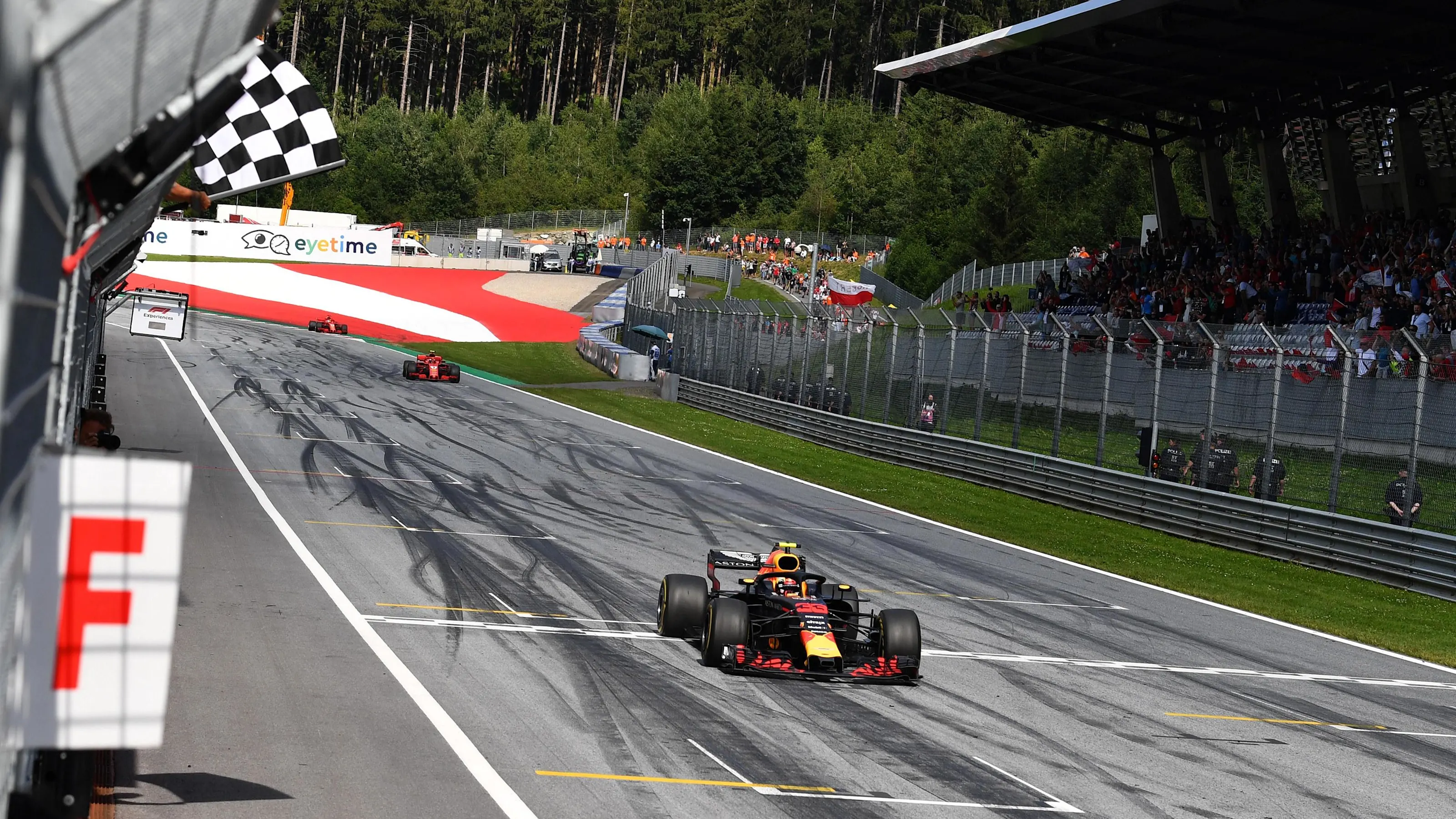 Race winner Max Verstappen (NED) Red Bull Racing RB14 takes the chequered flag at Formula One World