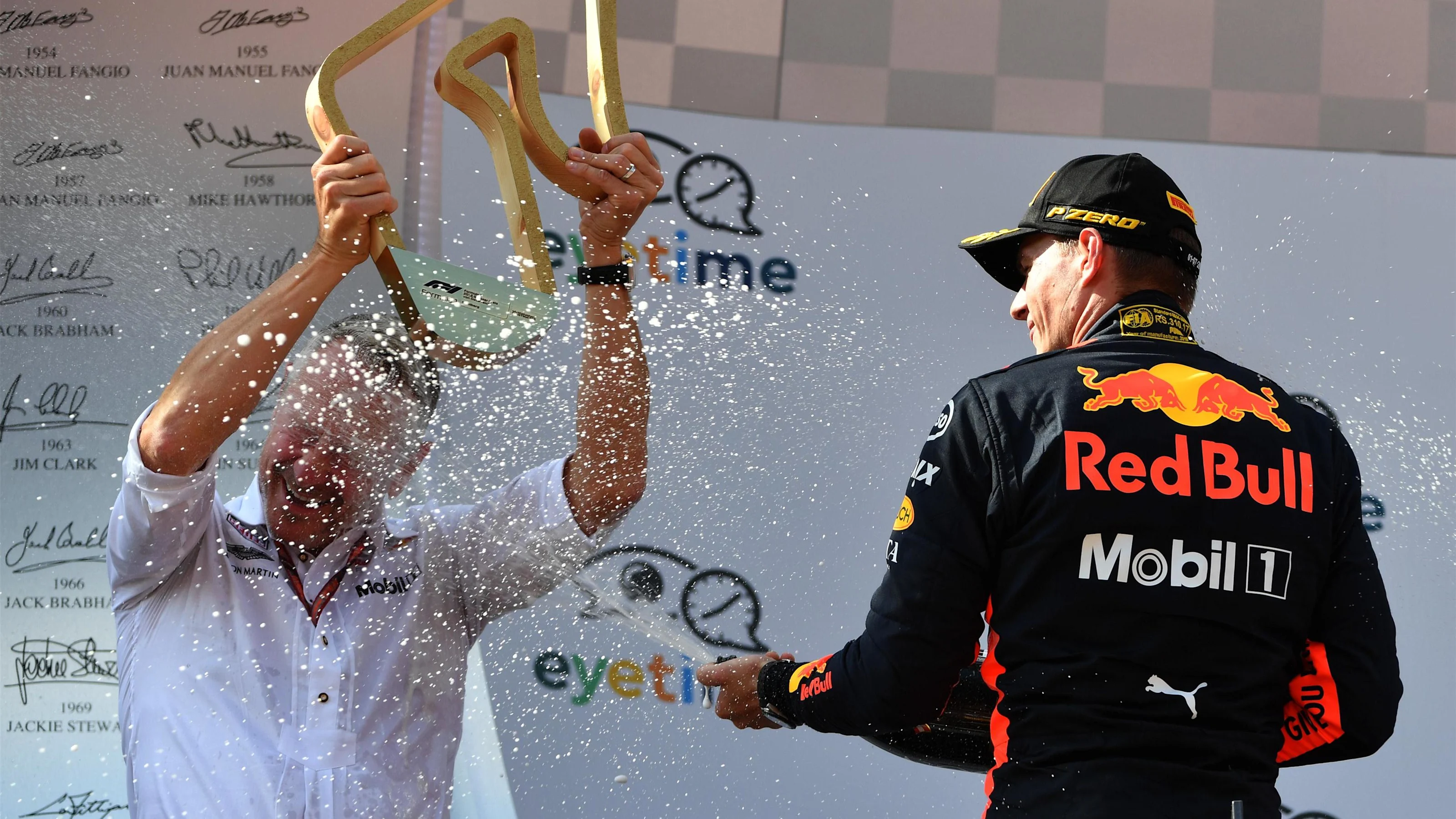 Race winner Max Verstappen (NED) Red Bull Racing celebrates on the podium with Jonathan Wheatley