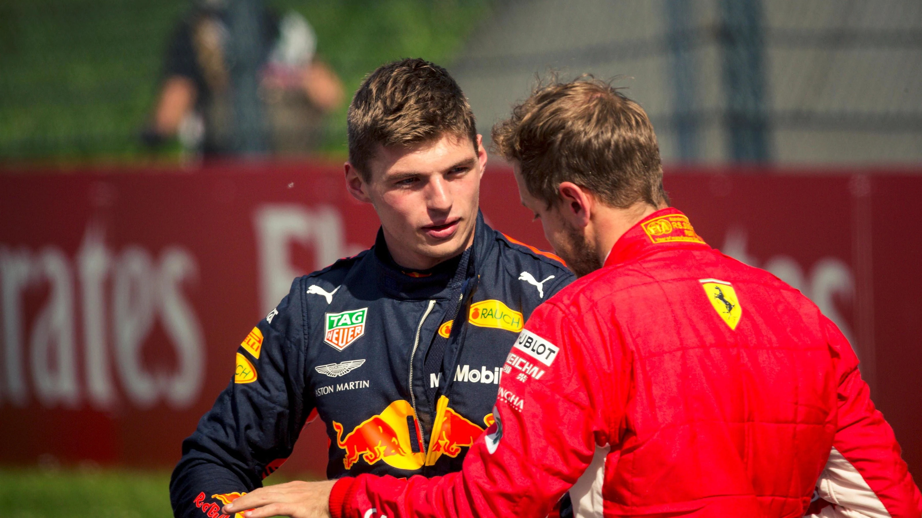 Max Verstappen (NED) Red Bull Racing and Sebastian Vettel (GER) Ferrari in parc ferme at Formula