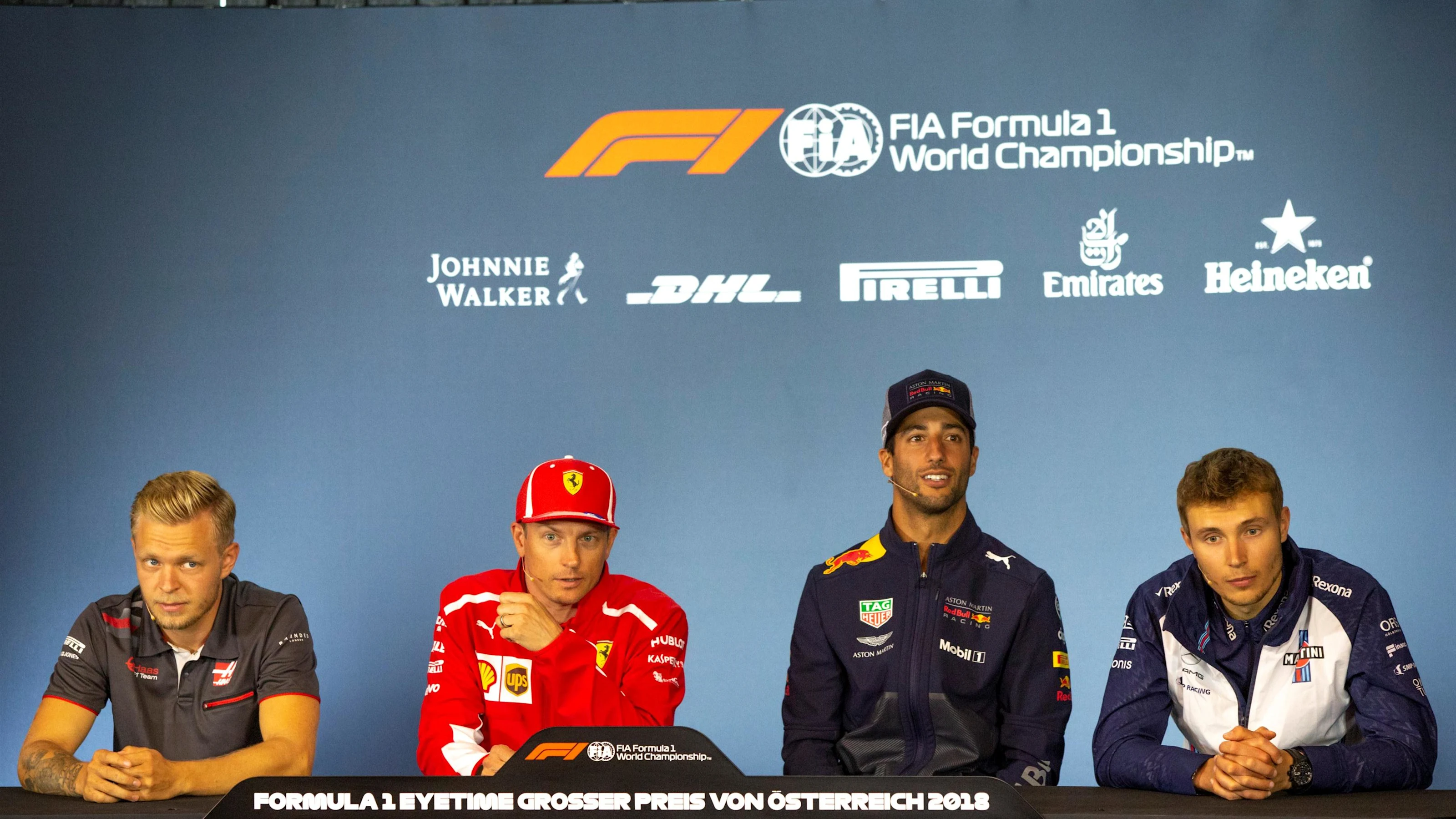 (L to R): Kevin Magnussen (DEN) Haas F1, Kimi Raikkonen (FIN) Ferrari, Daniel Ricciardo (AUS) Red