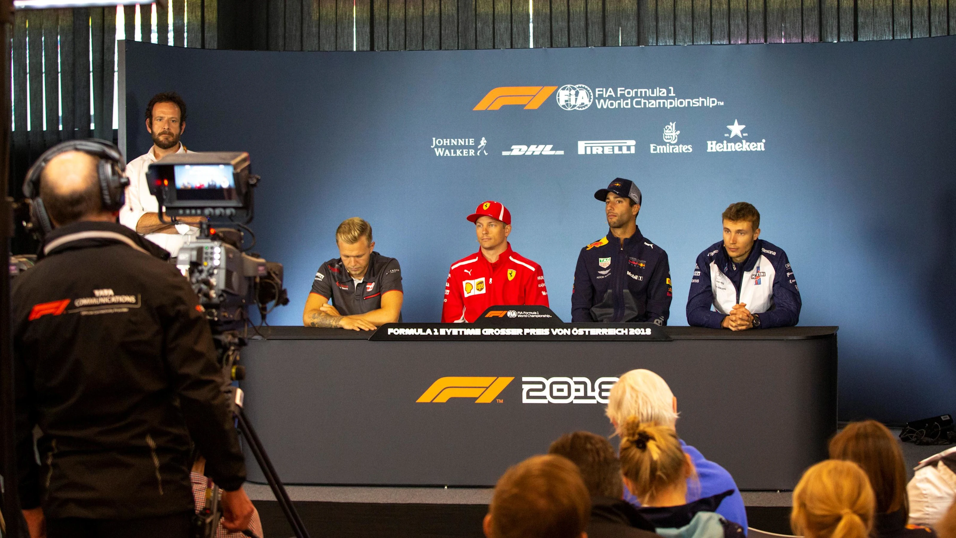 Kevin Magnussen (DEN) Haas F1, Kimi Raikkonen (FIN) Ferrari, Daniel Ricciardo (AUS) Red Bull Racing