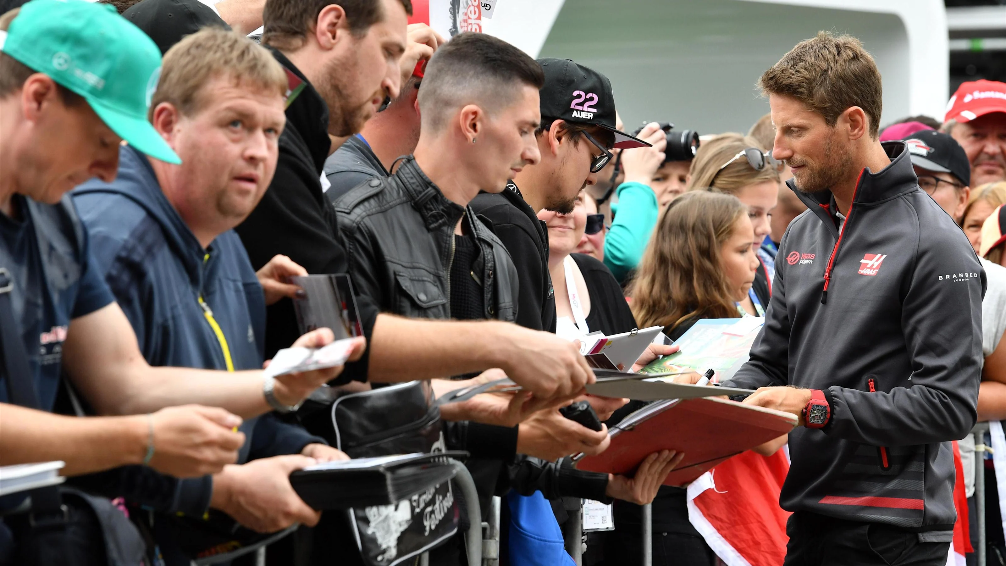 Romain Grosjean (FRA) Haas F1 signs autographs for the fans at Formula One World Championship, Rd9,