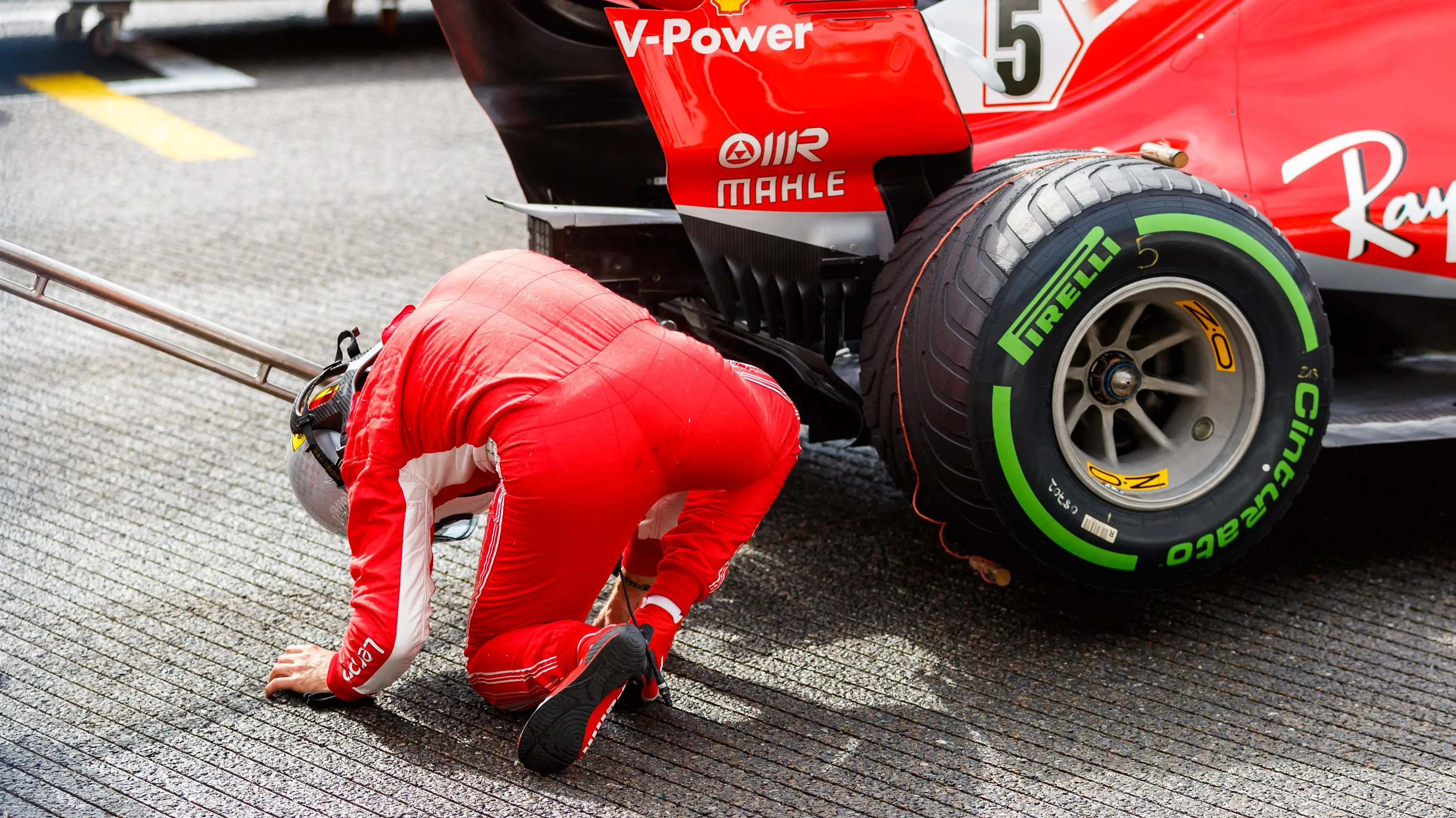 Sebastian Vettel, Ferrari SF71H look at the rear of the car in parc ferme at Formula One World