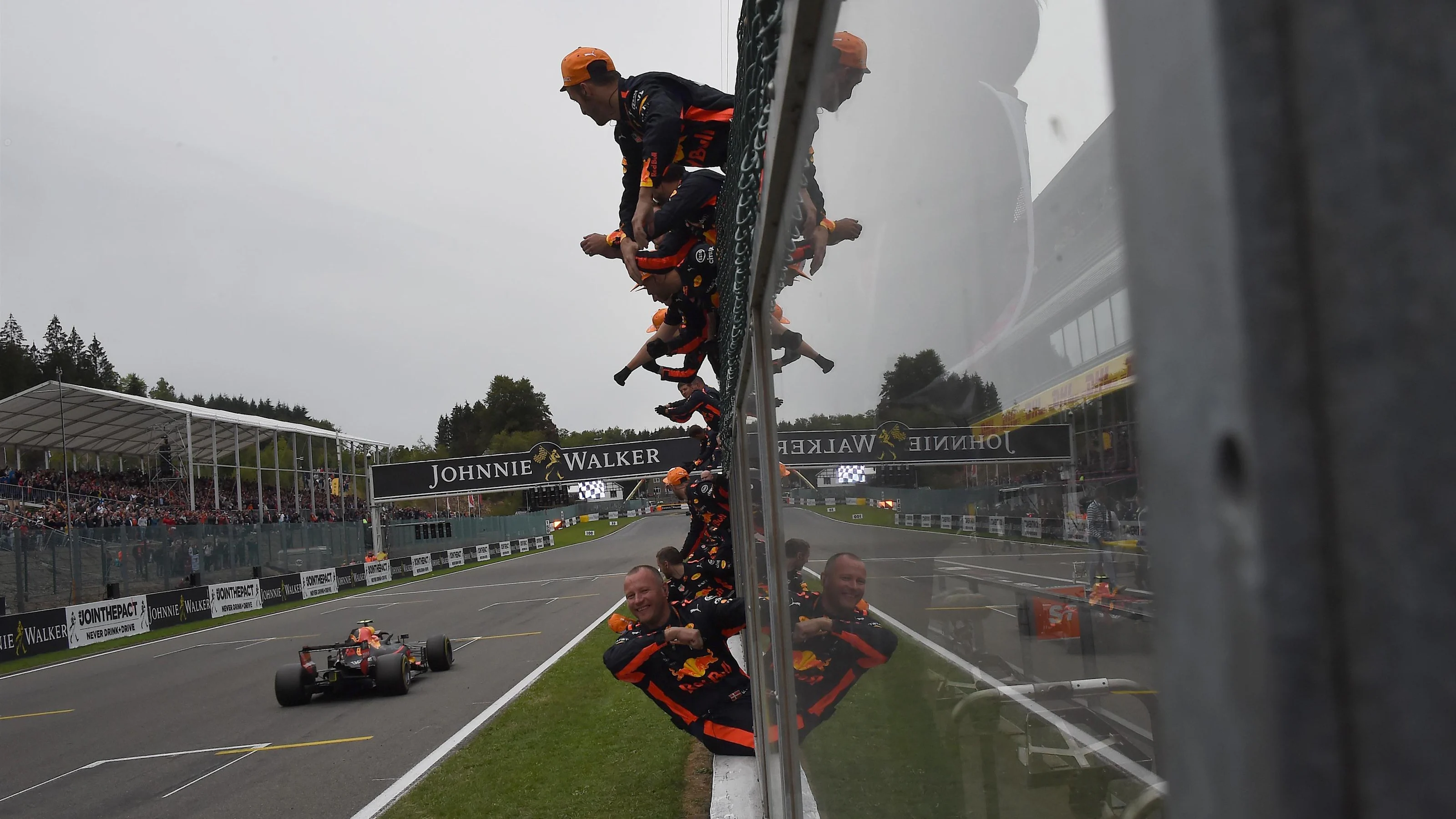 Max Verstappen, Red Bull Racing RB14 finshes crosses the line with his mechanics celebrating at