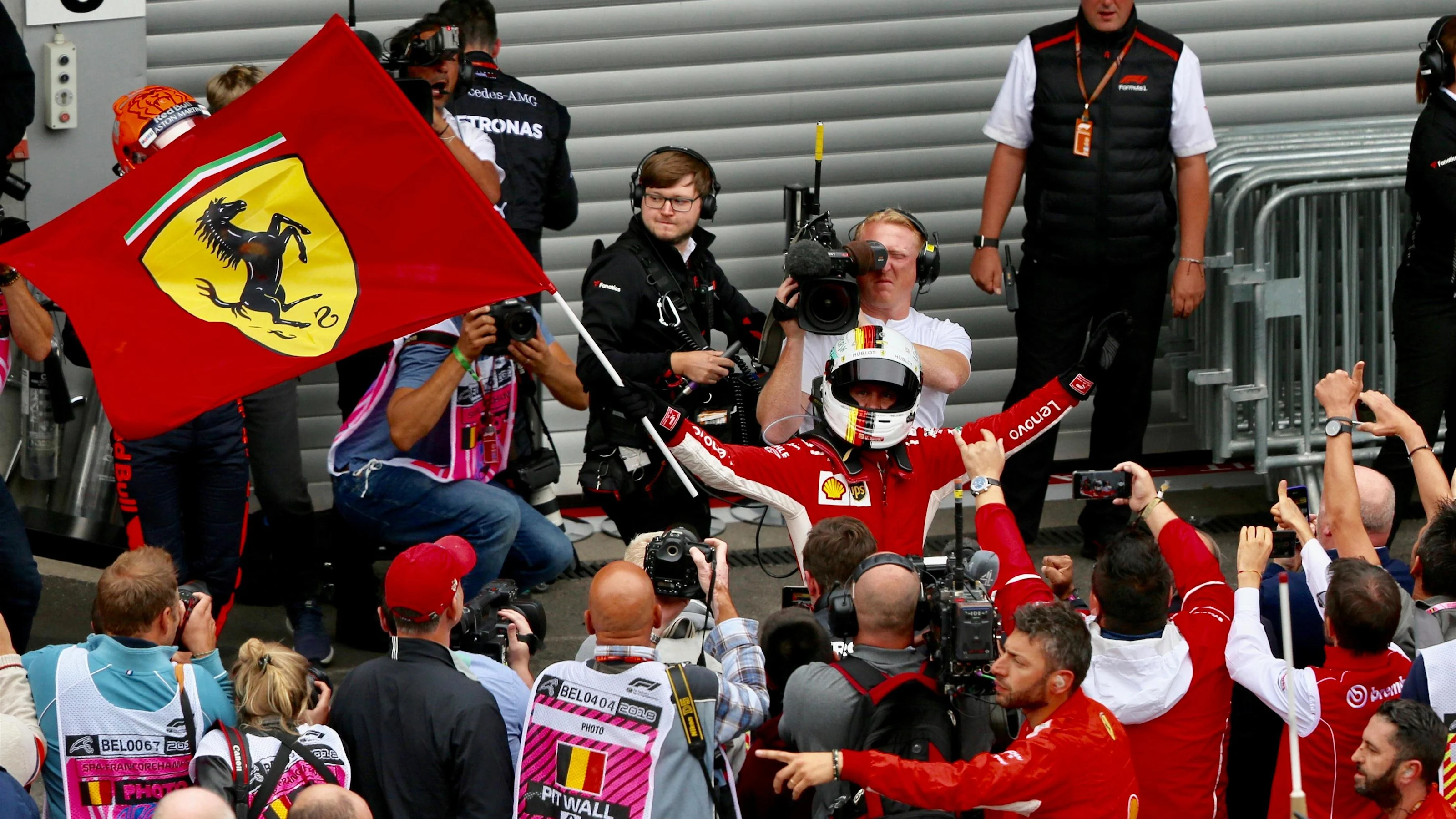 Sebastian Vettel, Ferrari celebrates with ferrari flag in parc ferme at Formula One World