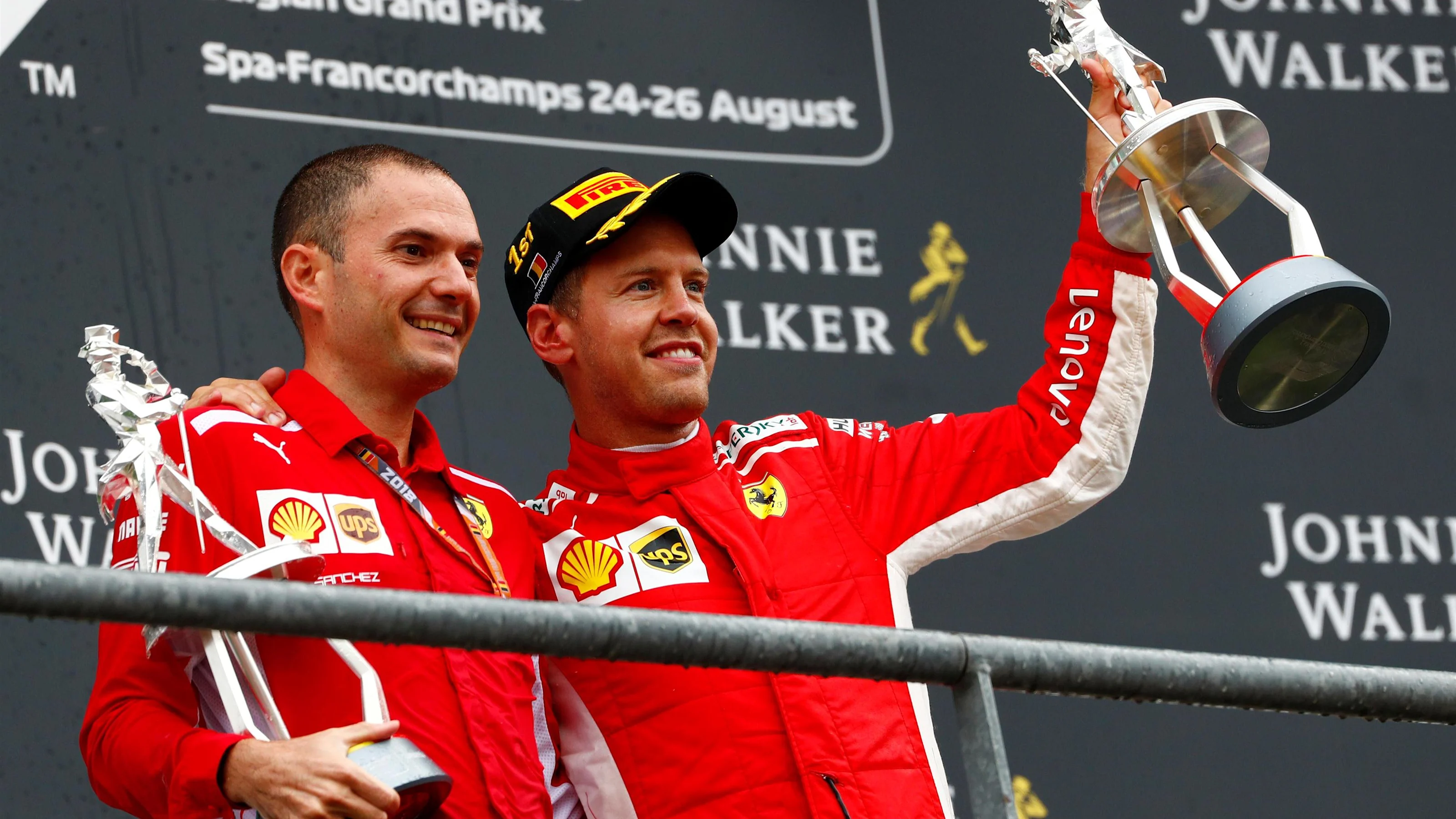 Race winner Sebastian Vettel, Ferrari celebrates on the podium with the trophy at Formula One World