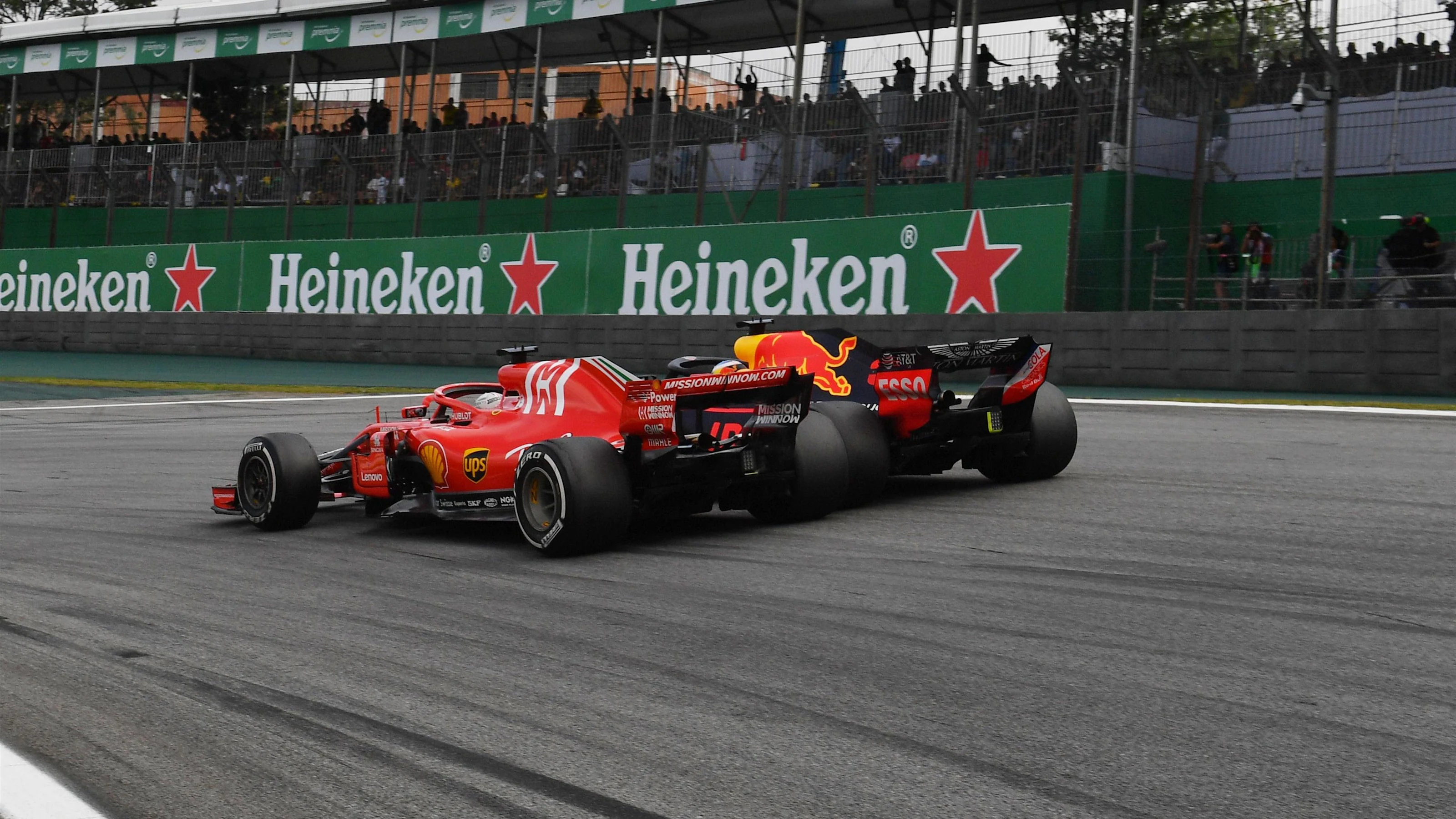 Sebastian Vettel, Ferrari SF71H and Daniel Ricciardo, Red Bull Racing RB14 battle at Formula One