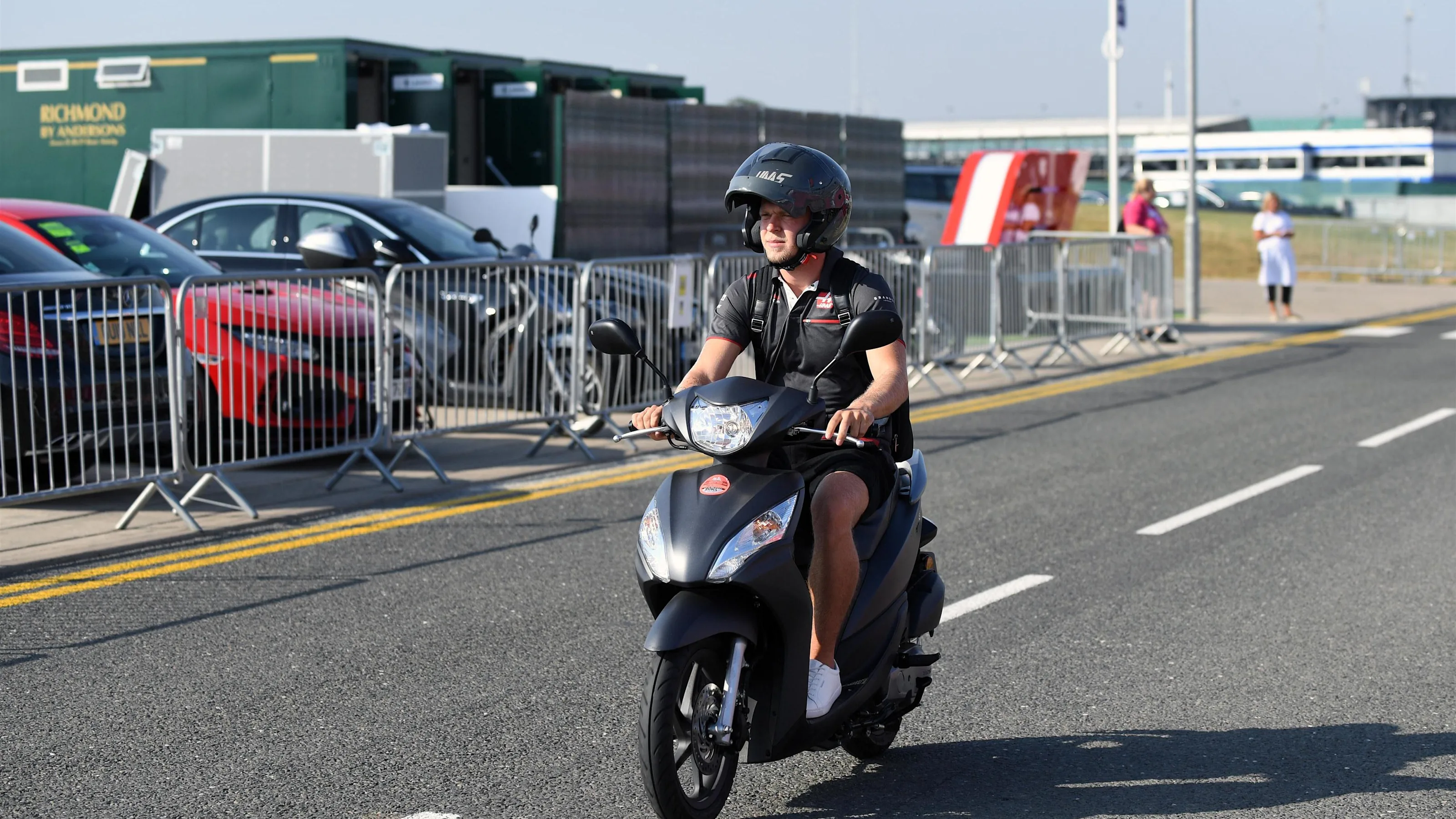 Kevin Magnussen (DEN) Haas F1 on a scooter at Formula One World Championship, Rd10, British Grand