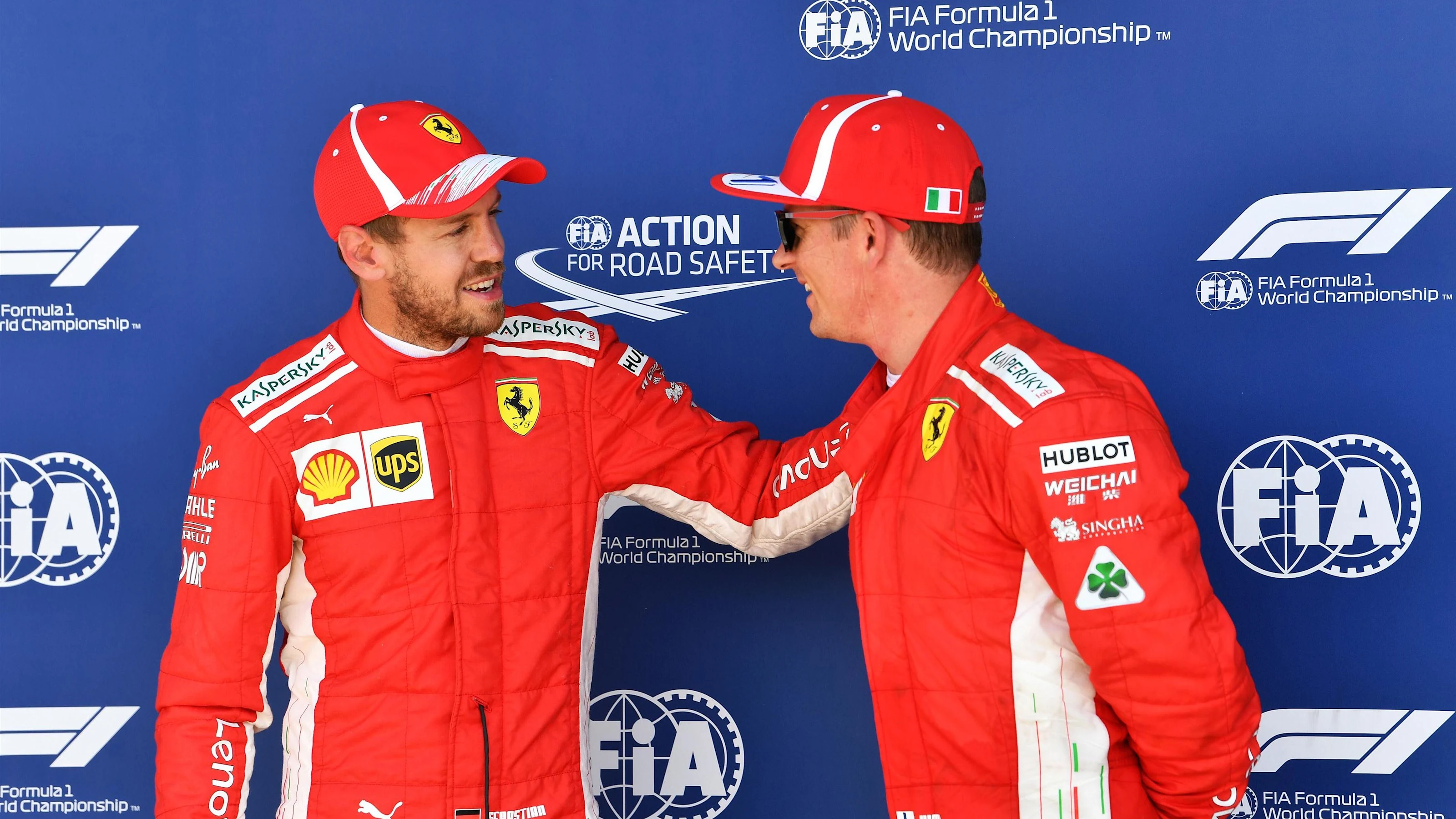 Sebastian Vettel (GER) Ferrari and Kimi Raikkonen (FIN) Ferrari celebrate in parc ferme at Formula