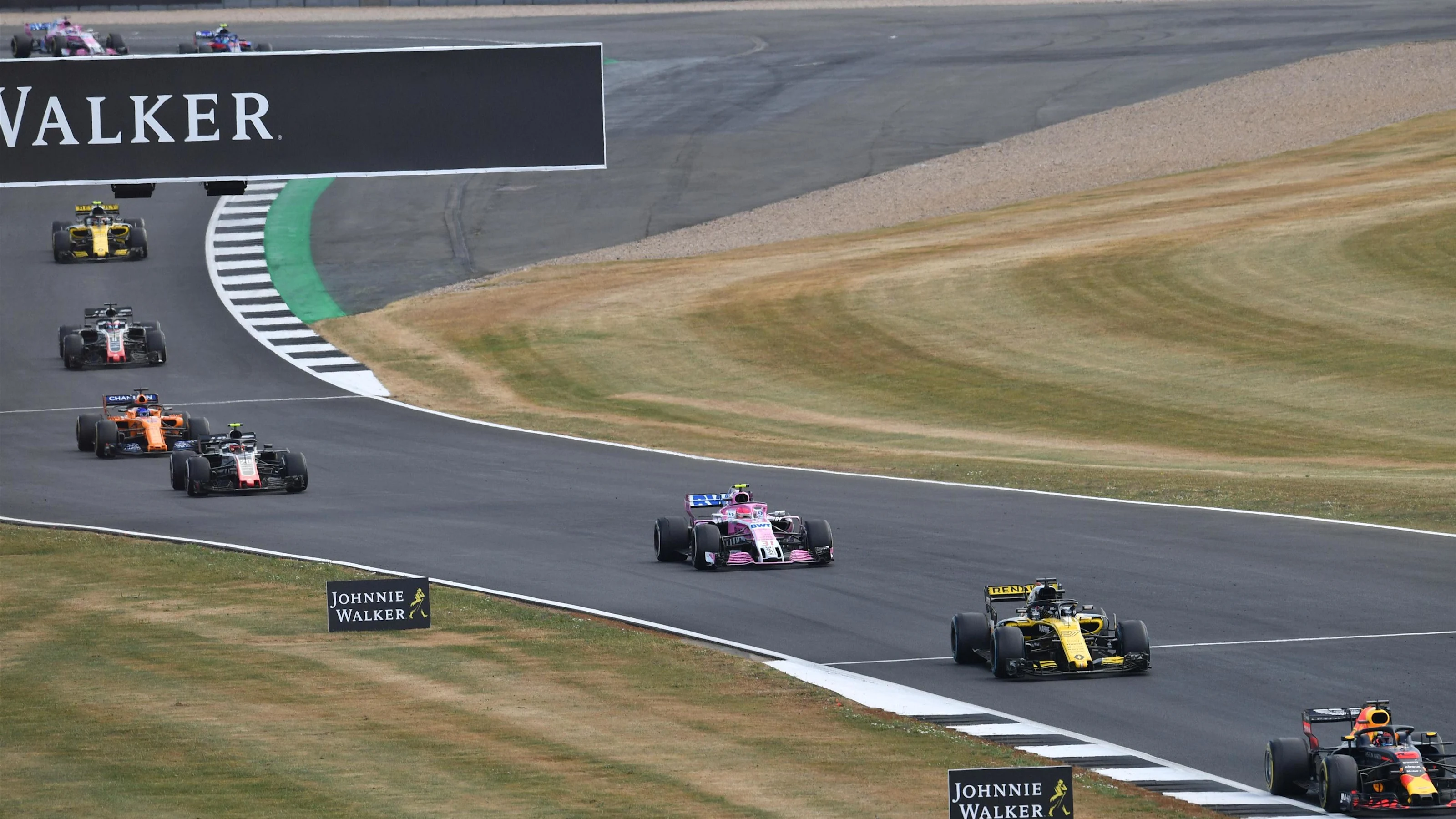 Nico Hulkenberg (GER) Renault Sport F1 Team RS18 and Esteban Ocon (FRA) Force India VJM11 at