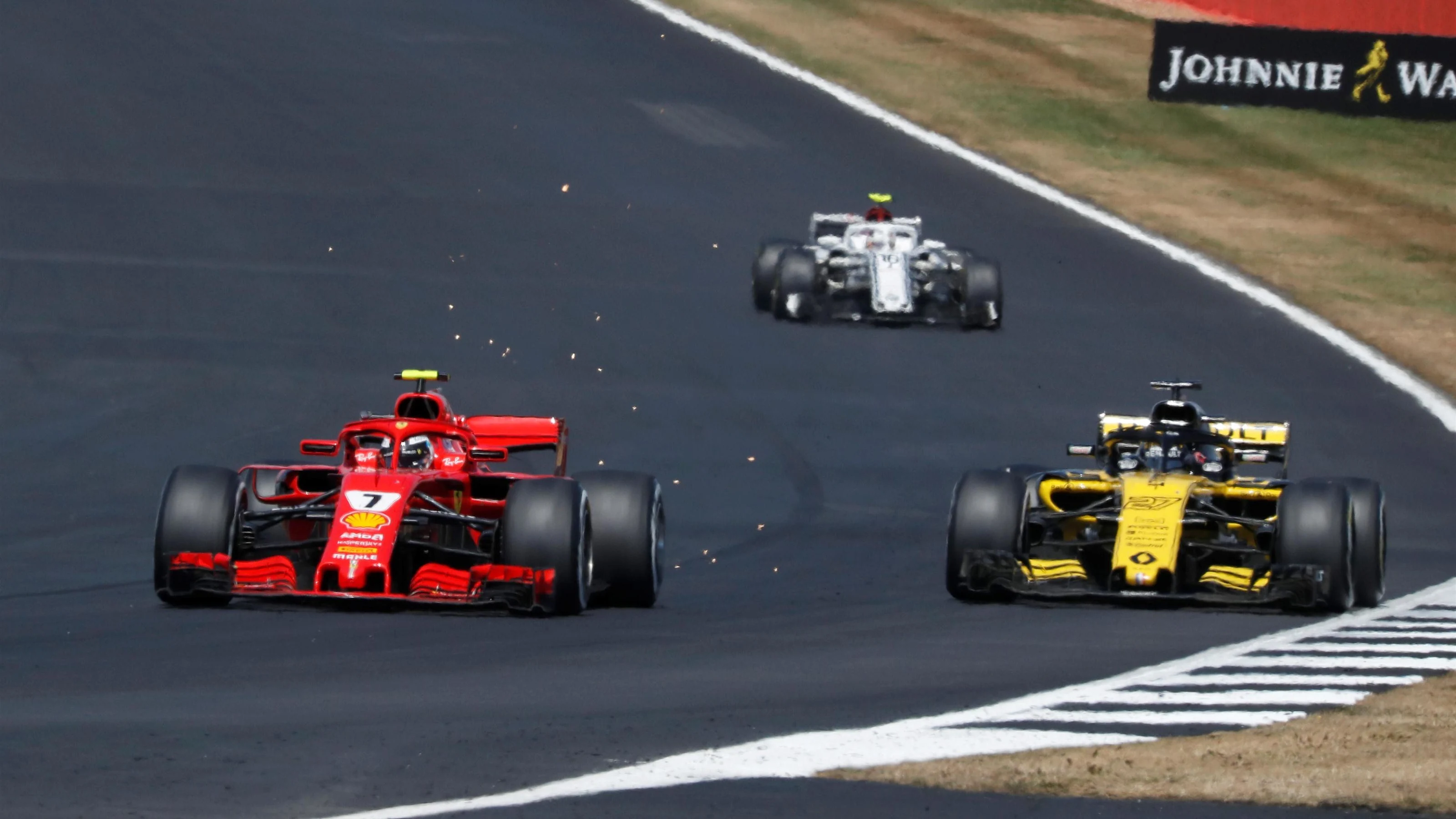 Kimi Raikkonen (FIN) Ferrari SF-71H overtakes Carlos Sainz jr (ESP) Renault Sport F1 Team RS18 at