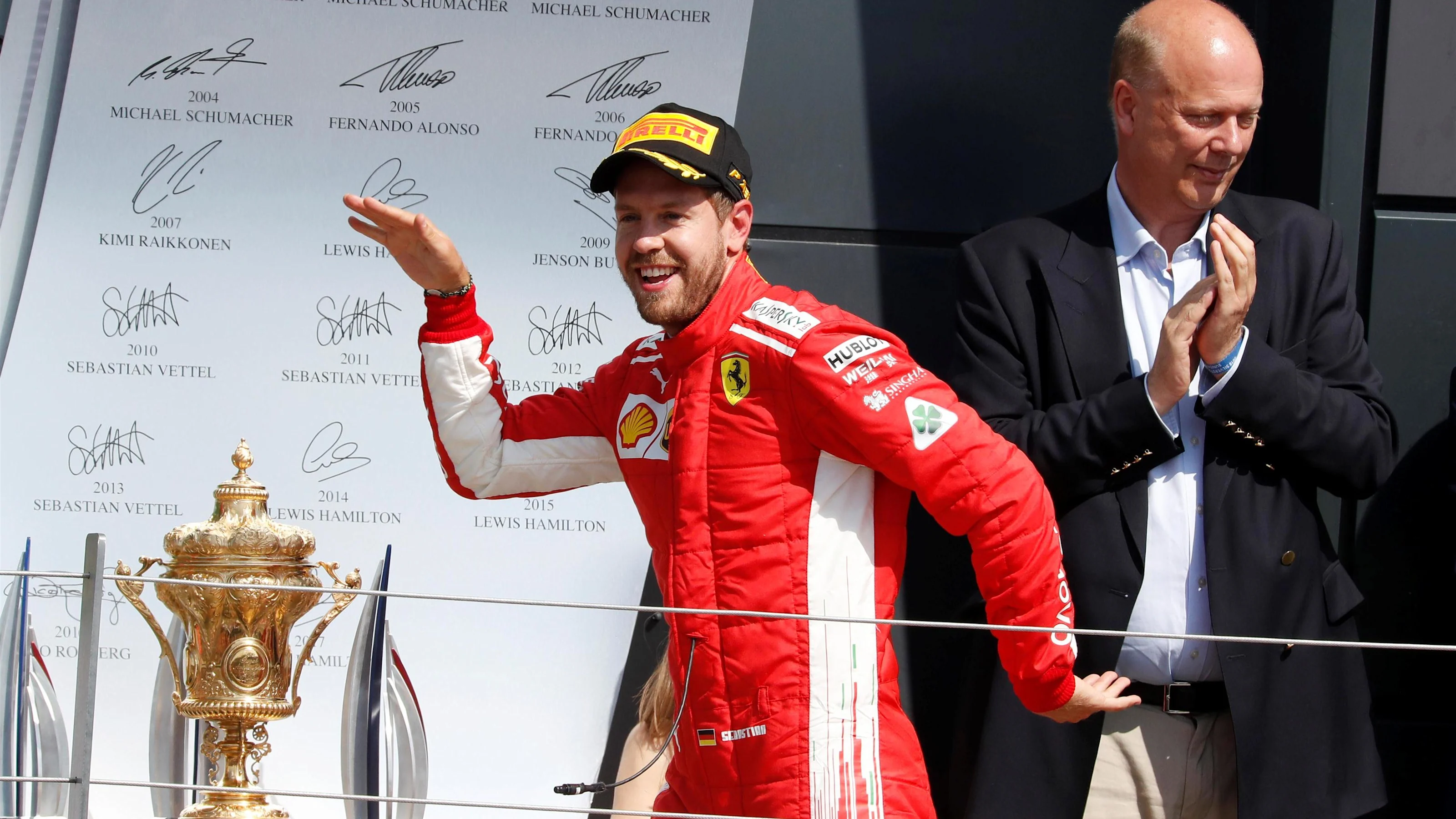Race winner Sebastian Vettel (GER) Ferrari celebrates opt at Formula One World Championship, Rd10,