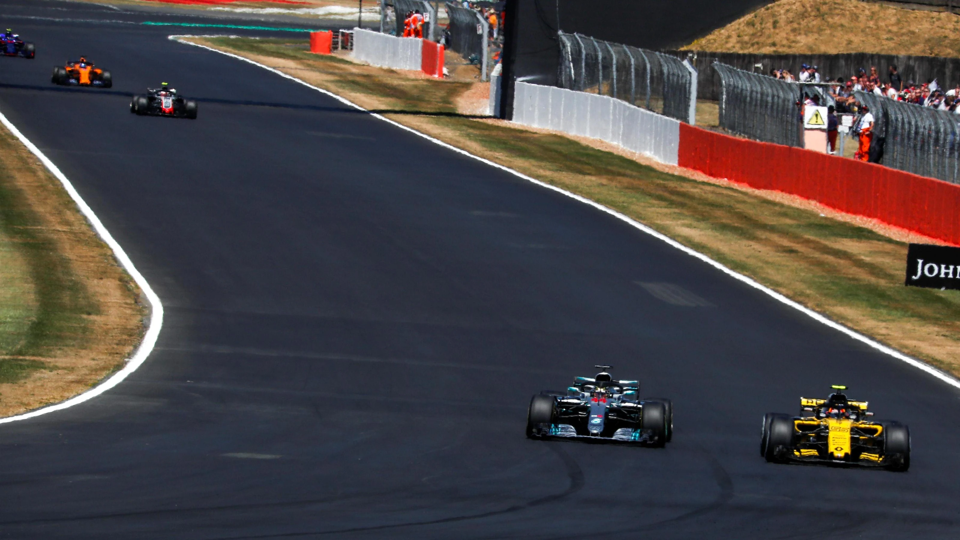Lewis Hamilton (GBR) Mercedes-AMG F1 W09 EQ Power+ and Carlos Sainz jr (ESP) Renault Sport F1 Team