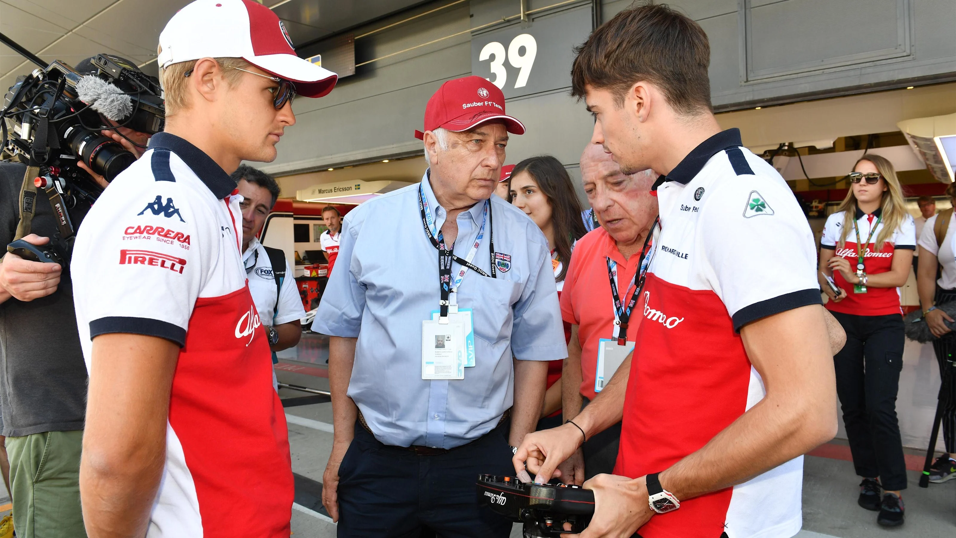 Marcus Ericsson (SWE) Alfa Romeo Sauber F1 Team and Charles Leclerc (MON) Alfa Romeo Sauber F1 Team
