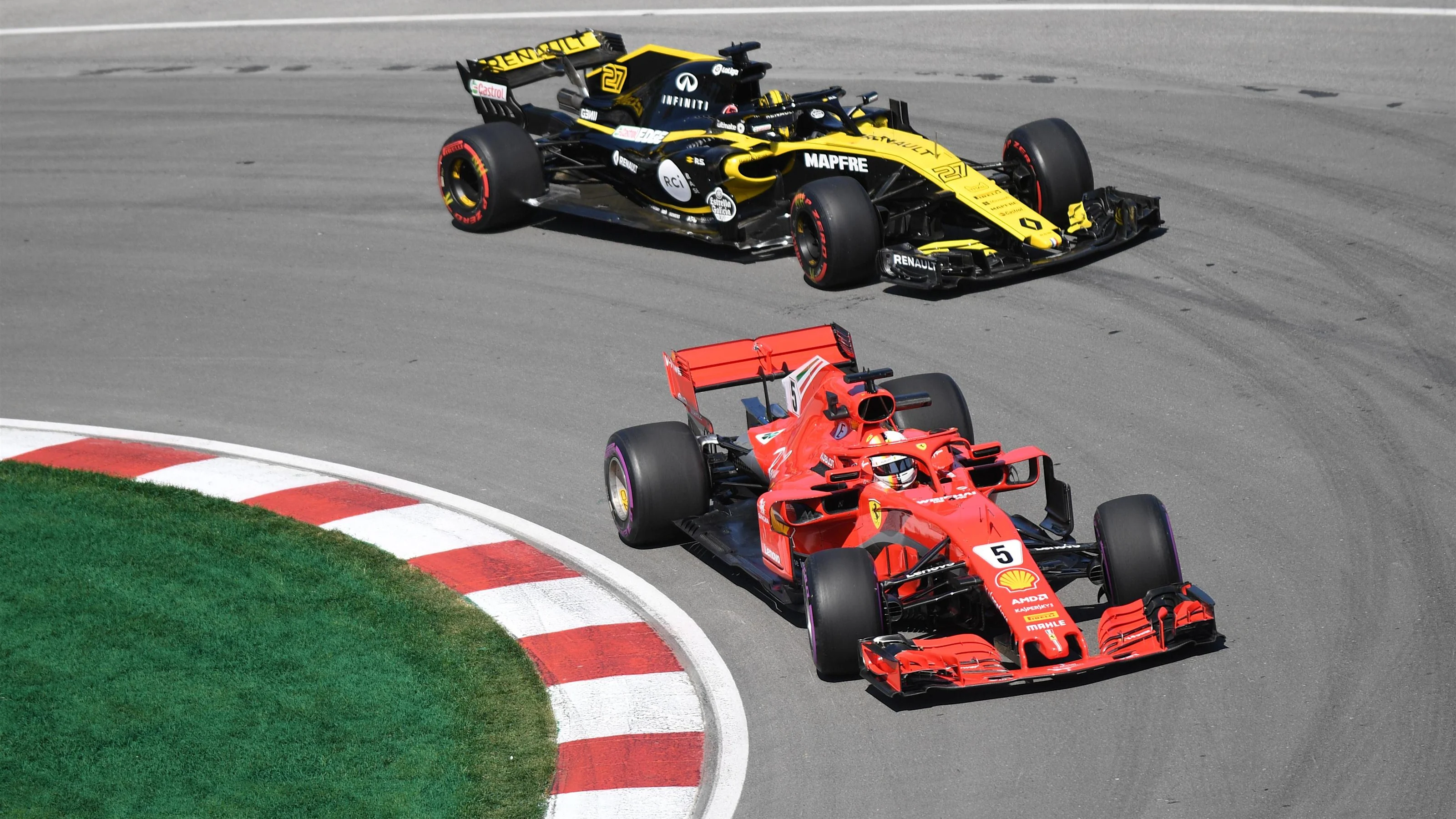 Sebastian Vettel (GER) Ferrari SF-71H and Nico Hulkenberg (GER) Renault Sport F1 Team RS18 at