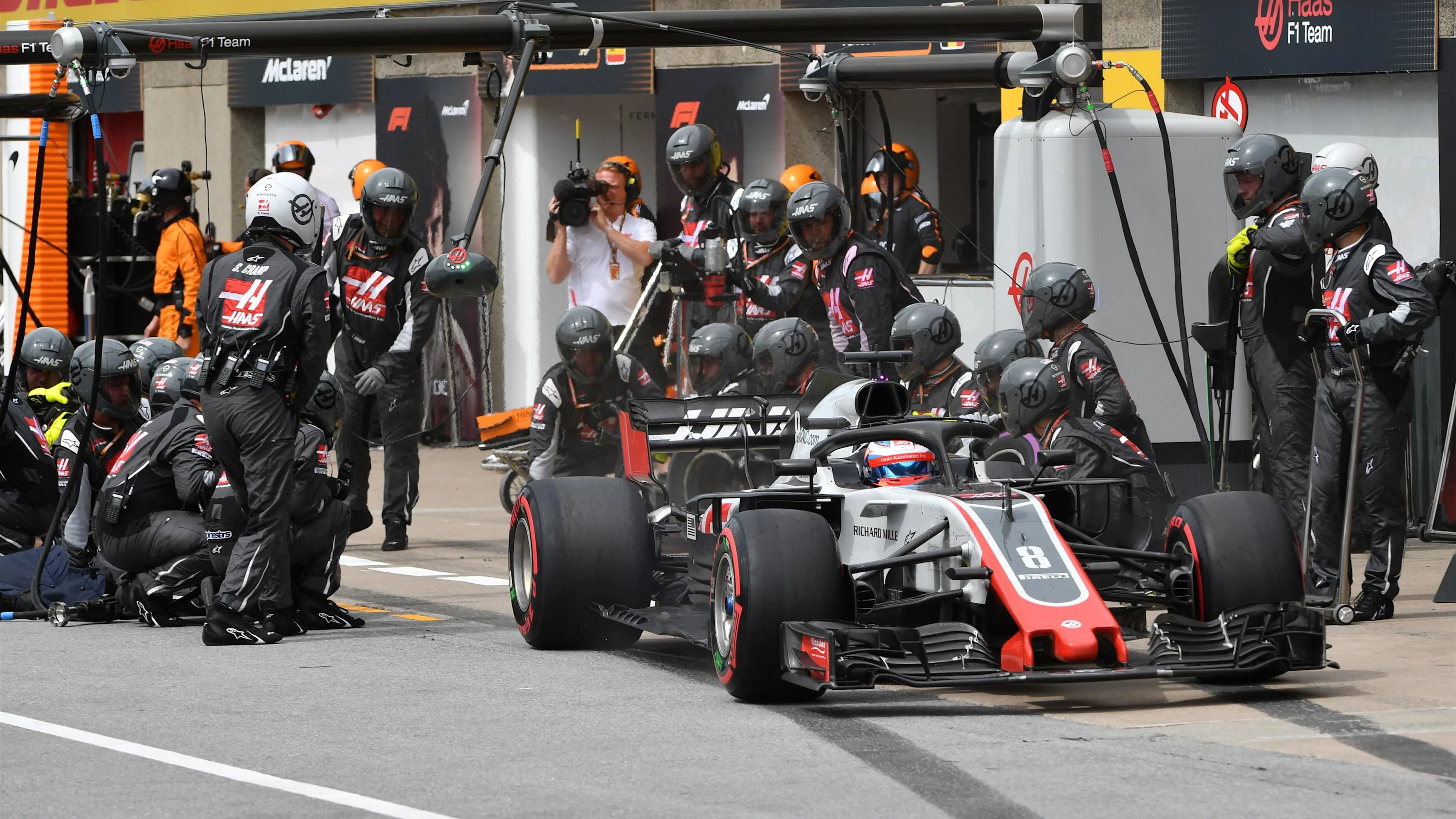 Romain Grosjean (FRA) Haas VF-18 pit stop at Formula One World Championship, Rd7, Canadian Grand
