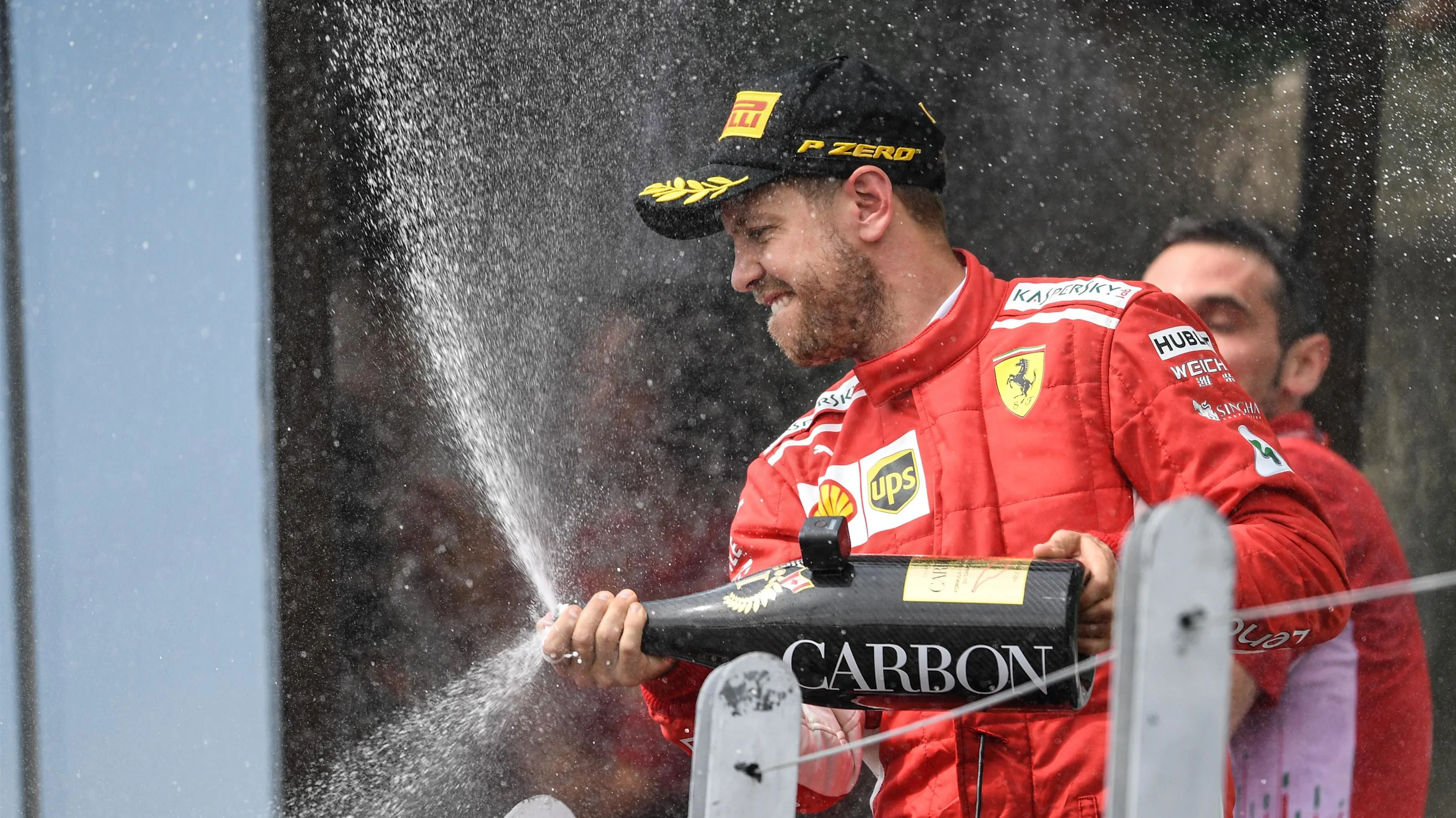 Sebastian Vettel (GER) Ferrari celebrates on the podium with the champagne at Formula One World