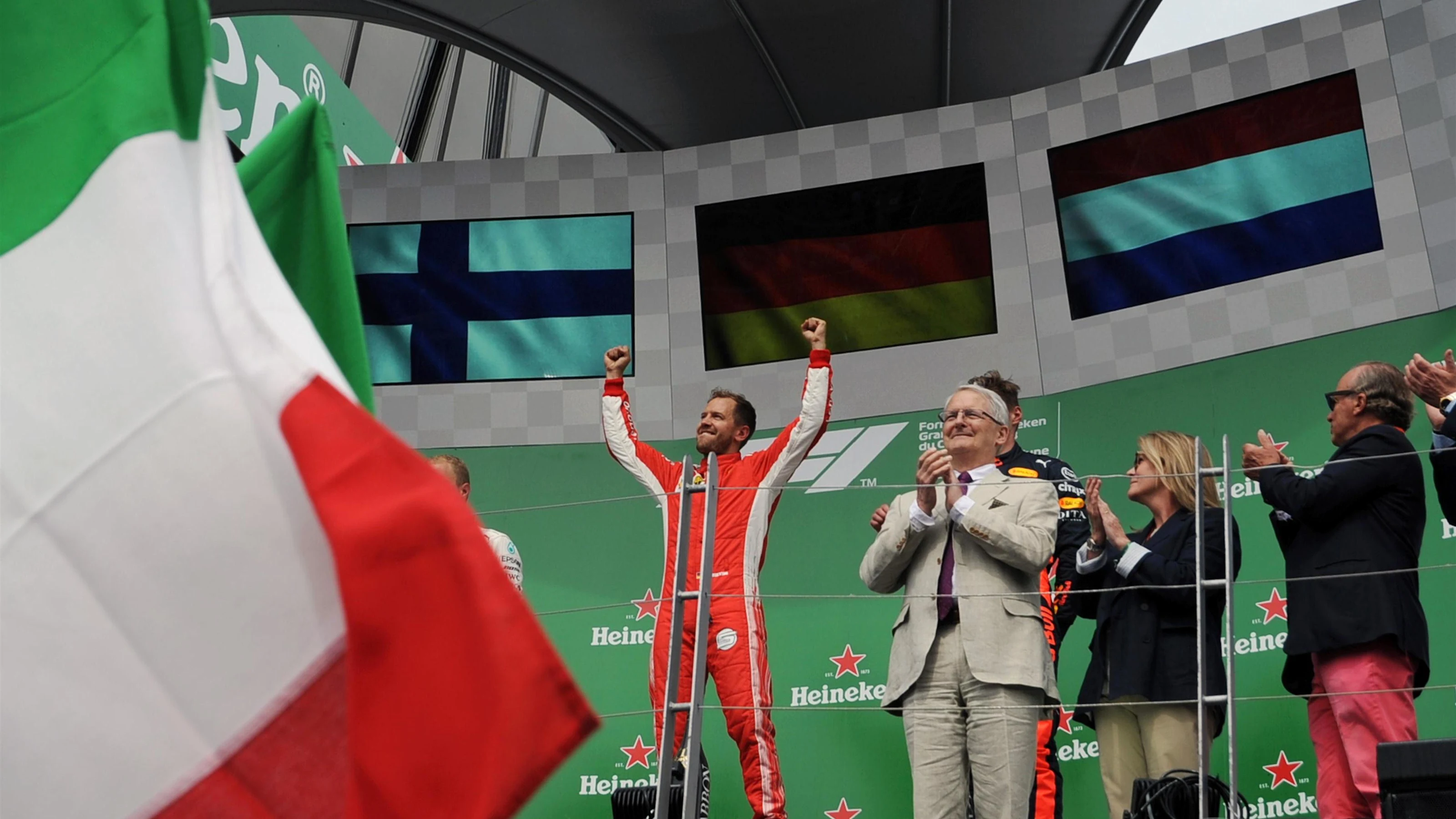 Race winner Sebastian Vettel (GER) Ferrari celebrates on the podium at Formula One World