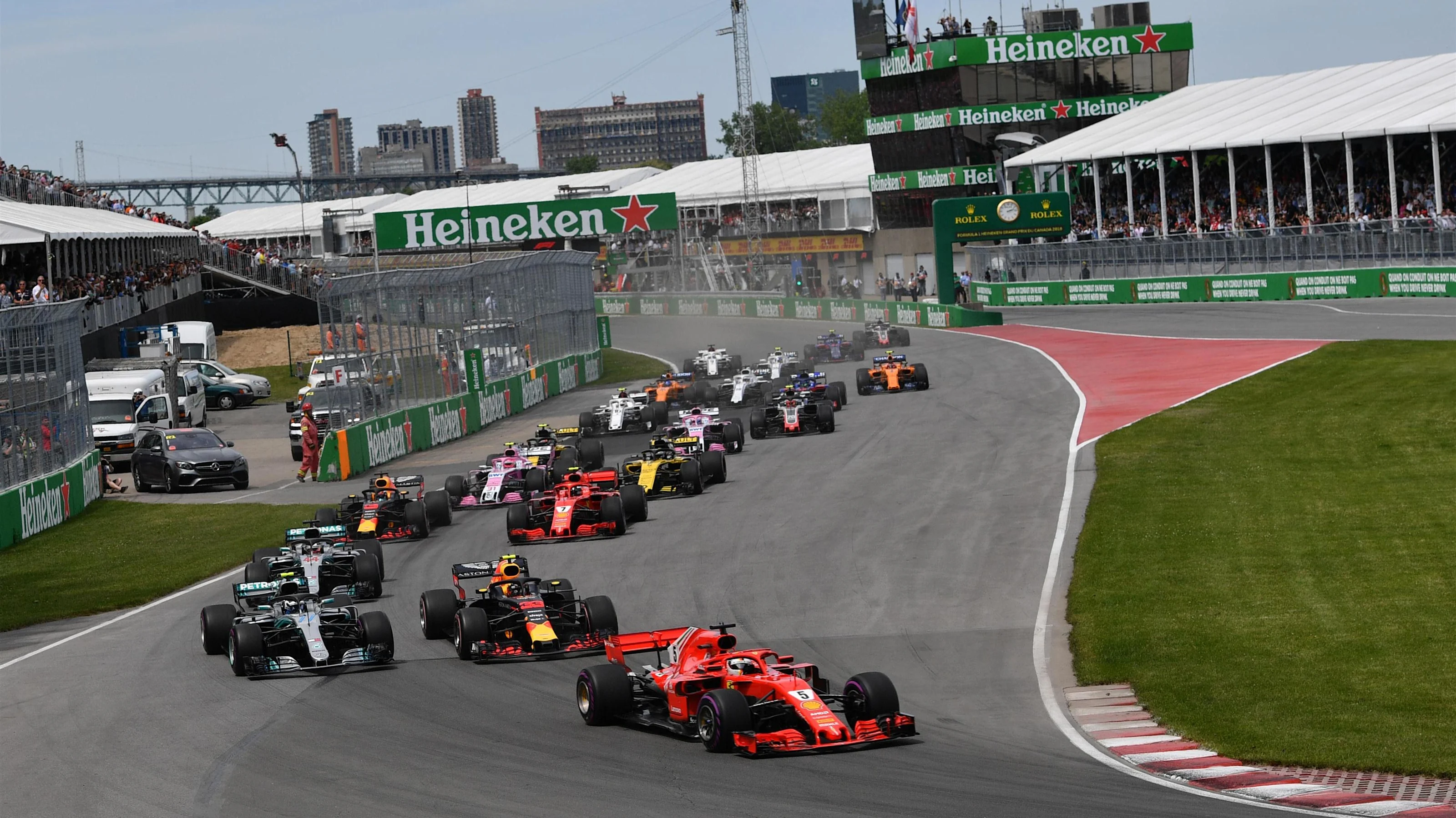 Sebastian Vettel (GER) Ferrari SF-71H leads at the start of the race at Formula One World