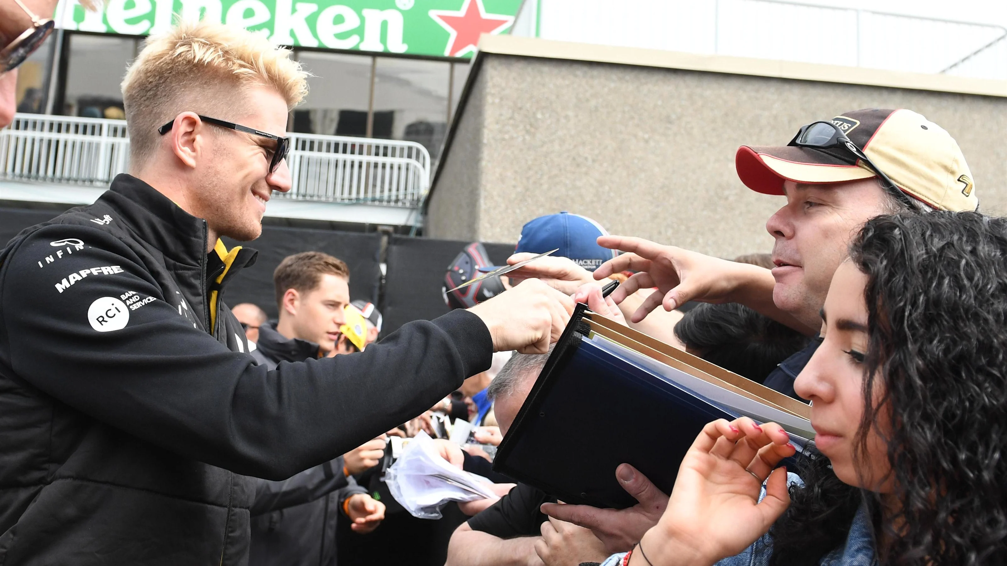 Nico Hulkenberg (GER) Renault Sport F1 Team signs autographs for the fans at Formula One World