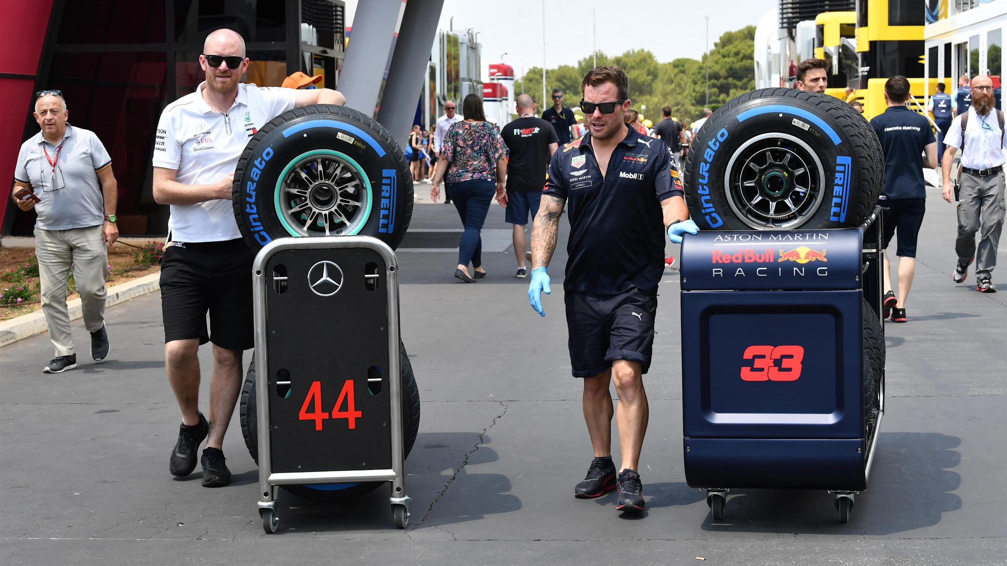 Red Bull Racing and Mercedes AMG F1 mechanics with Pirelli tyres at Formula One World Championship,