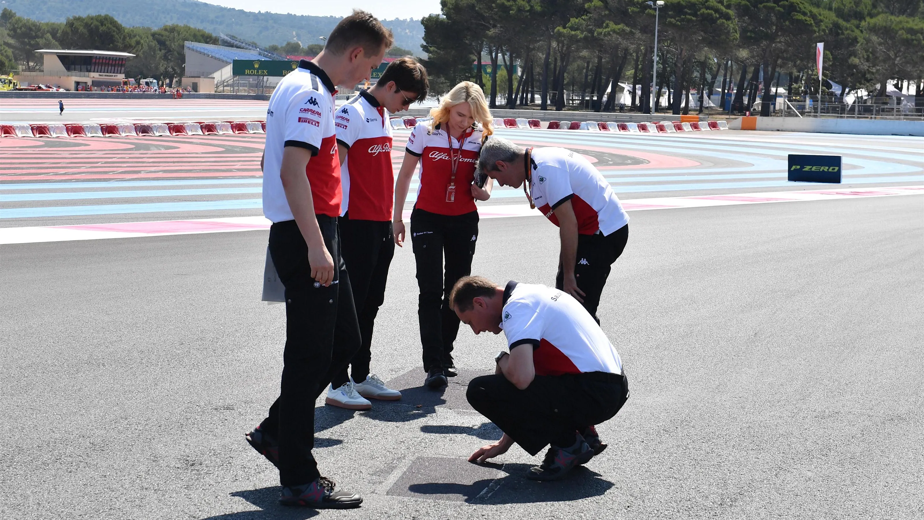 Charles Leclerc (MON) Alfa Romeo Sauber F1 Team walks the track with Xevi Pujolar (ESP) Alfa Romeo