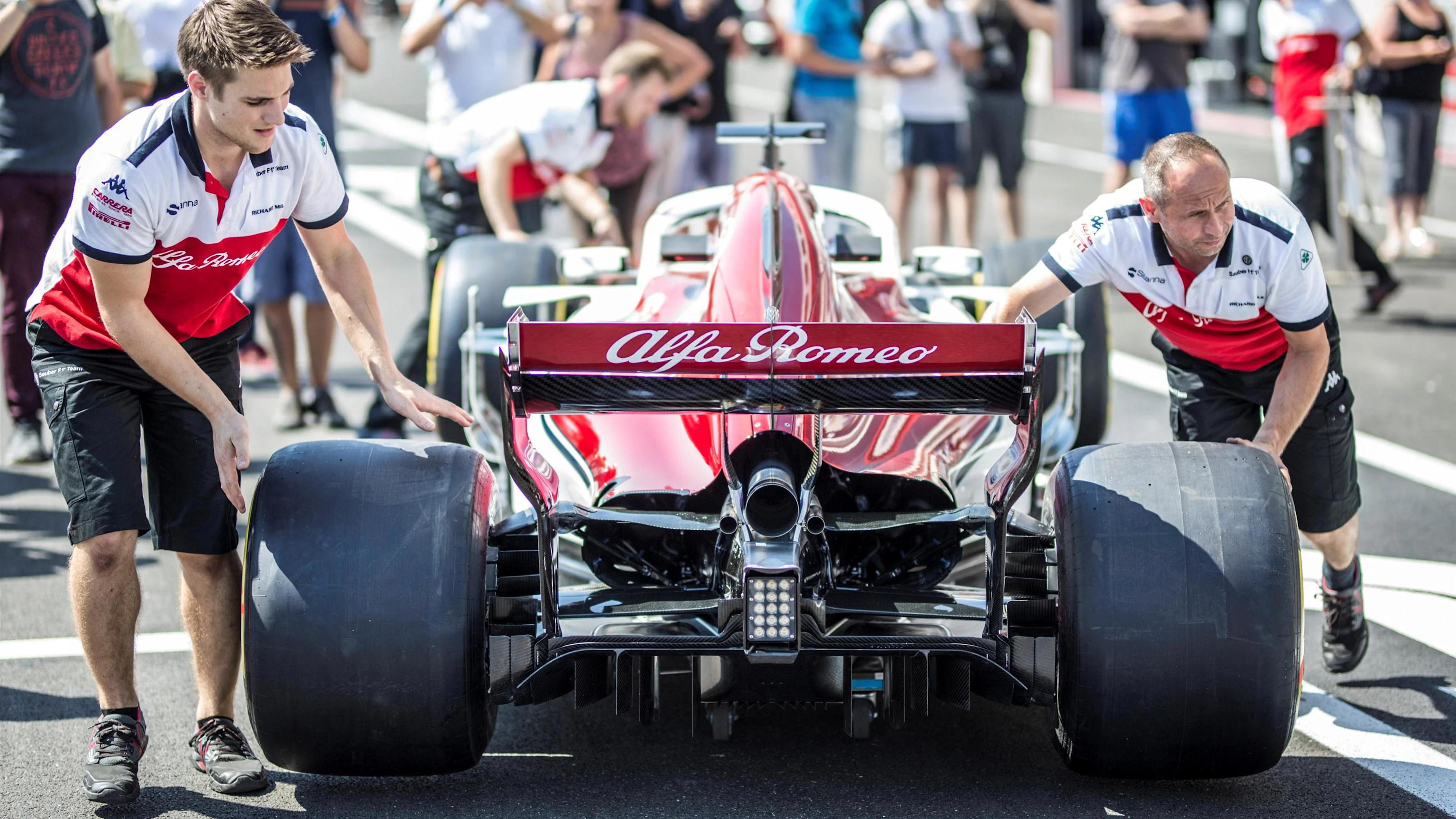 Alfa Romeo Sauber F1 Team mechanics with Alfa Romeo Sauber C37 at Formula One World Championship,
