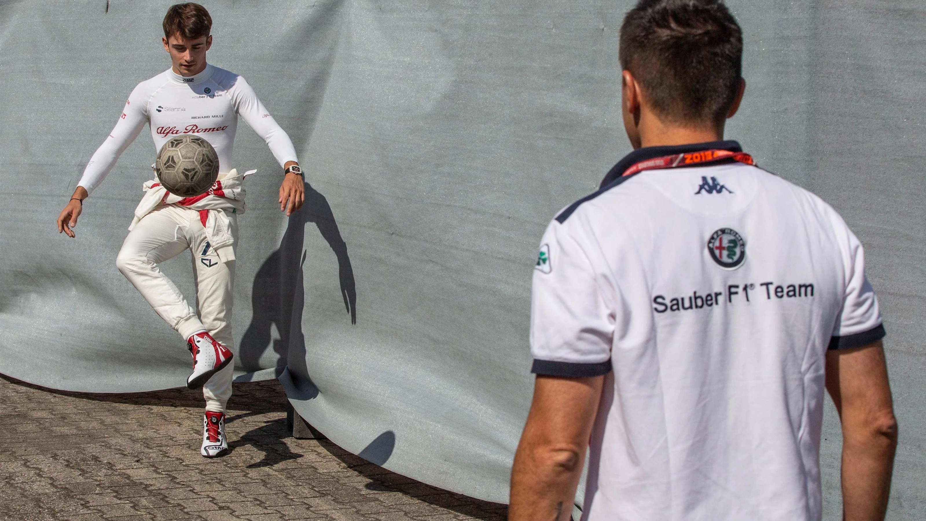 Charles Leclerc (MON) Alfa Romeo Sauber F1 Team warms up playing football with his trainer at