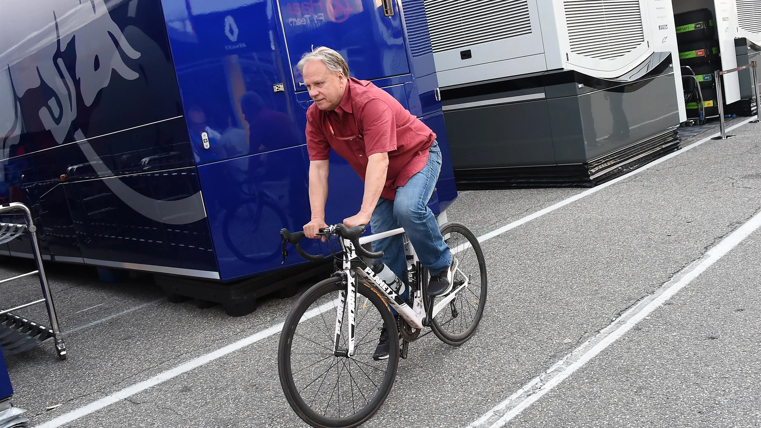 Gene Haas (USA) Founder and Chairman, Haas F1 Team on a bike at Formula One World Championship,