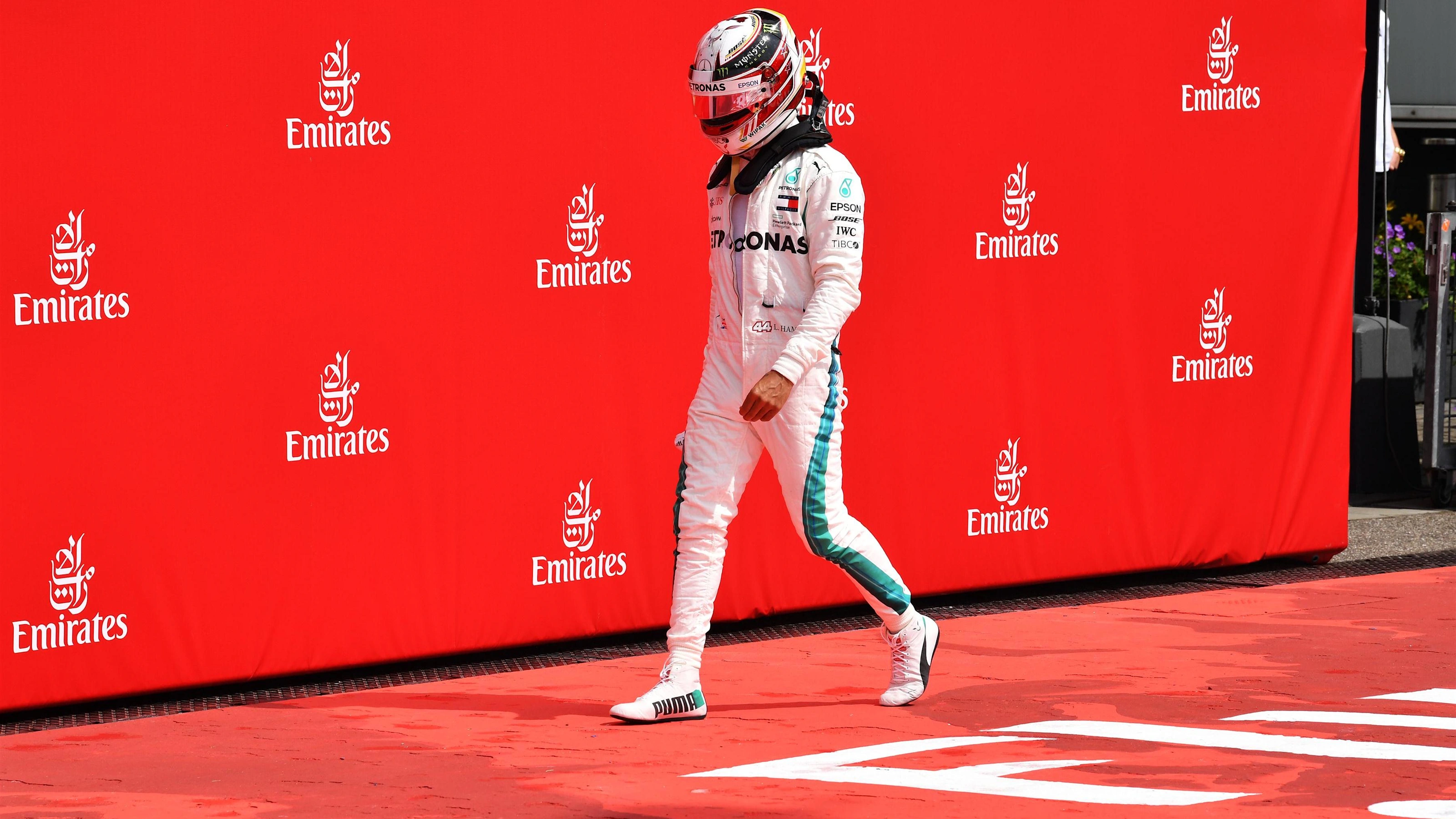 Lewis Hamilton (GBR) Mercedes-AMG F1 walks in after stopping on track in Q1 at Formula One World