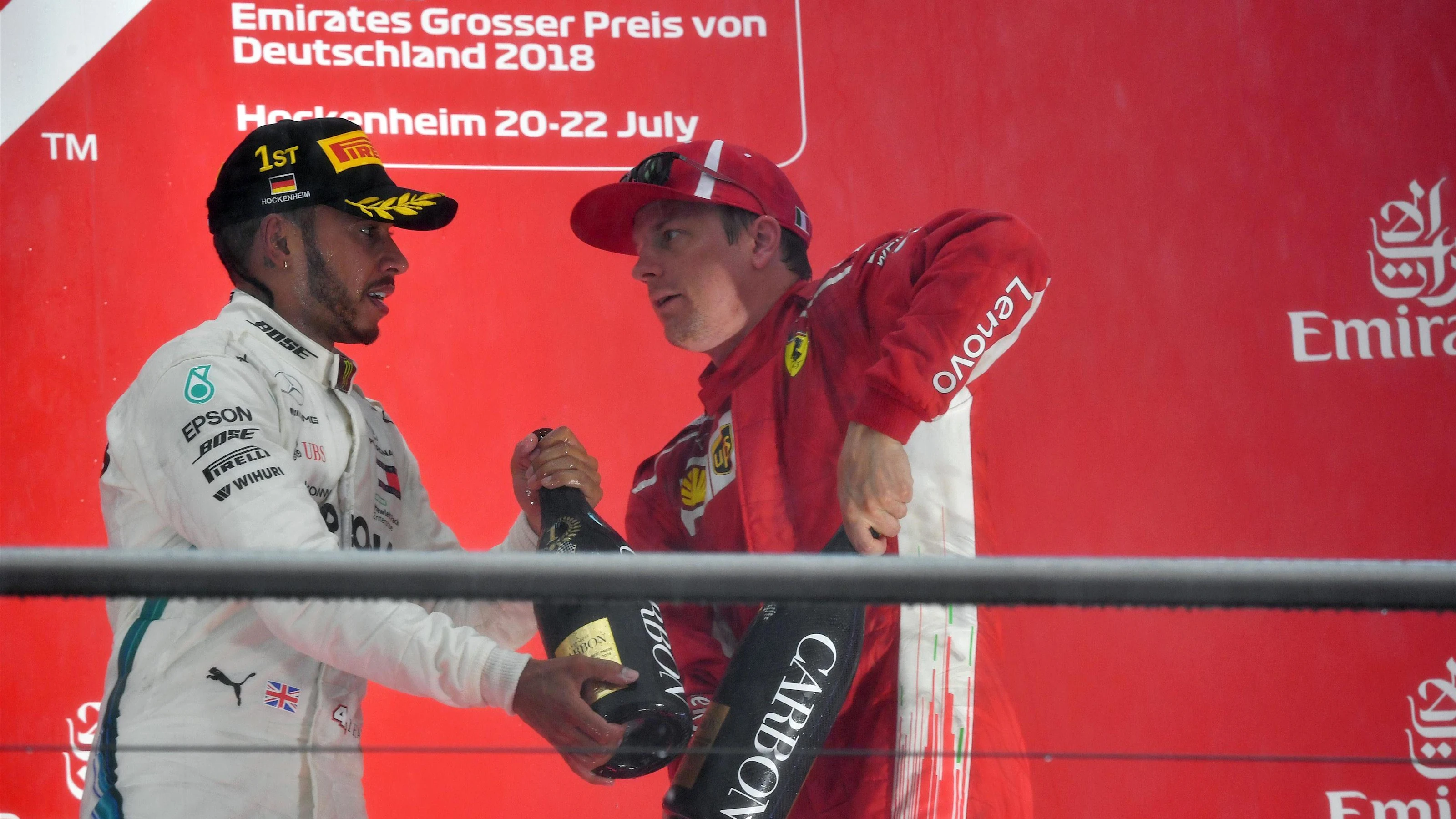 Lewis Hamilton (GBR) Mercedes-AMG F1 and Kimi Raikkonen (FIN) Ferrari celebrate on the podium with