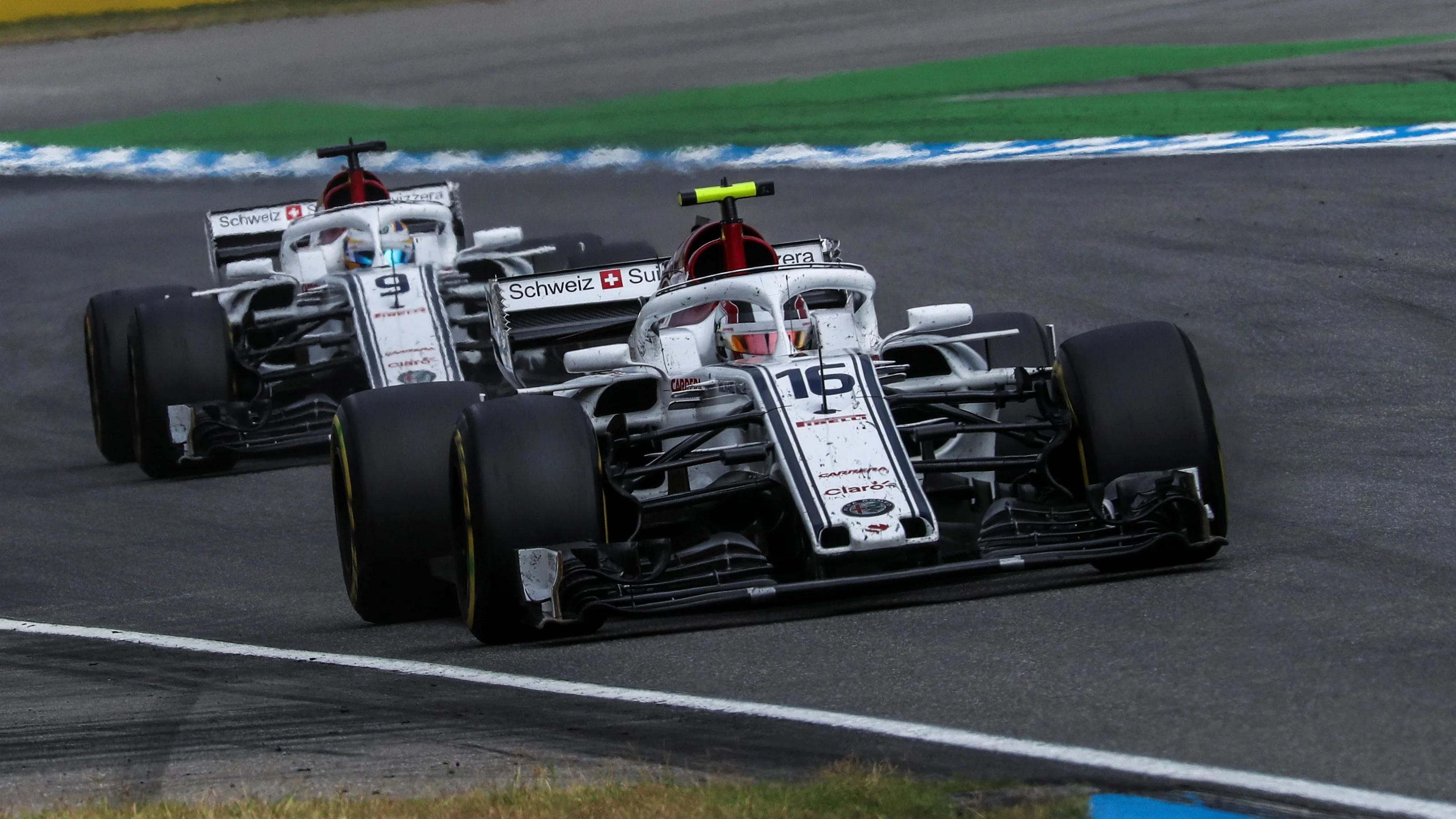 Charles Leclerc (MON) Alfa Romeo Sauber C37 and Marcus Ericsson (SWE) Alfa Romeo Sauber C37 at